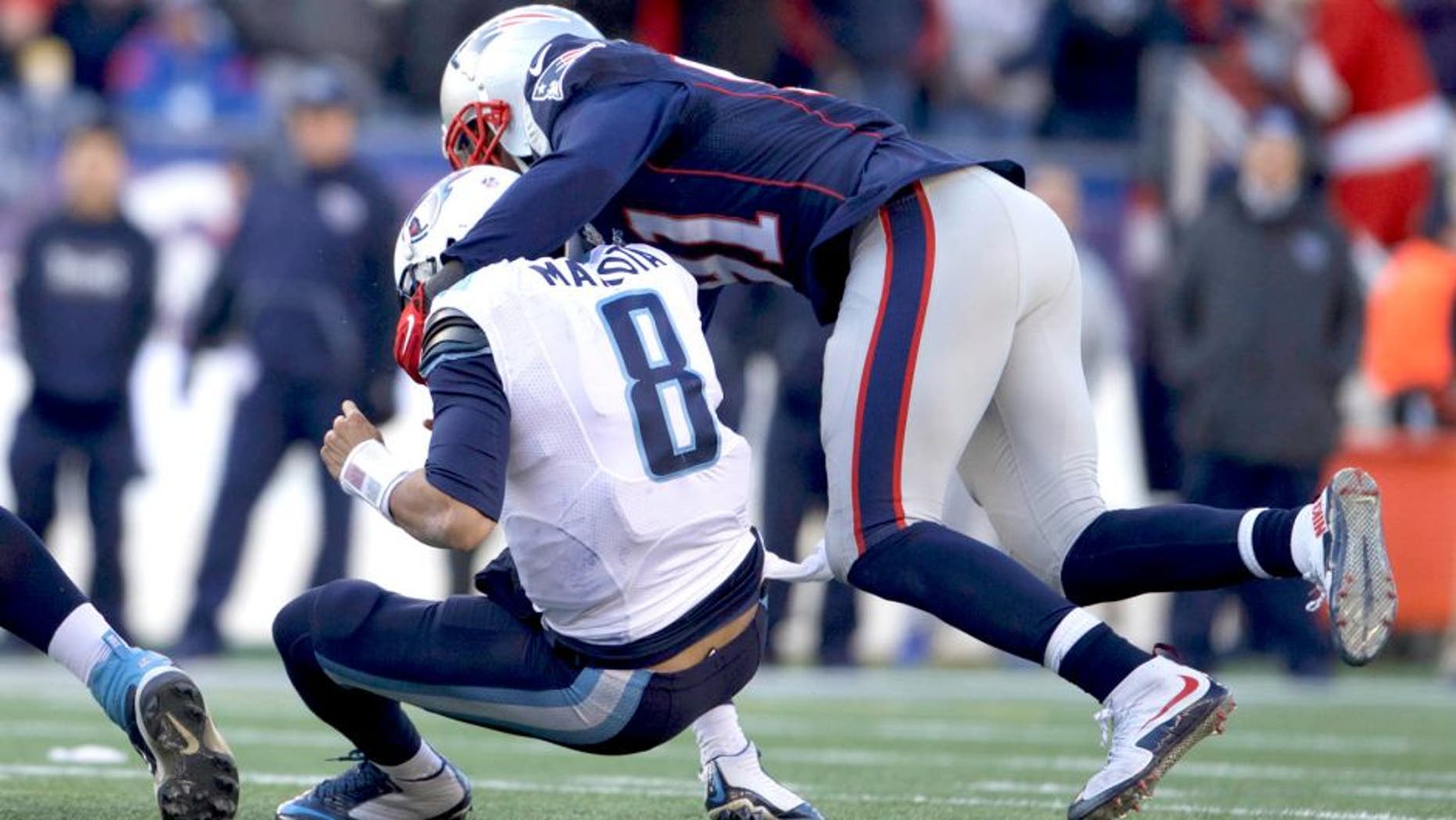 Dec 20, 2015; Foxborough, MA, USA; New England Patriots outside linebacker Jamie Collins (91) sacks Tennessee Titans quarterback Marcus Mariota (8) in the first half at Gillette Stadium. The Patriots defeated the Titans 33-16. Mandatory Credit: David Butler II-USA TODAY Sports