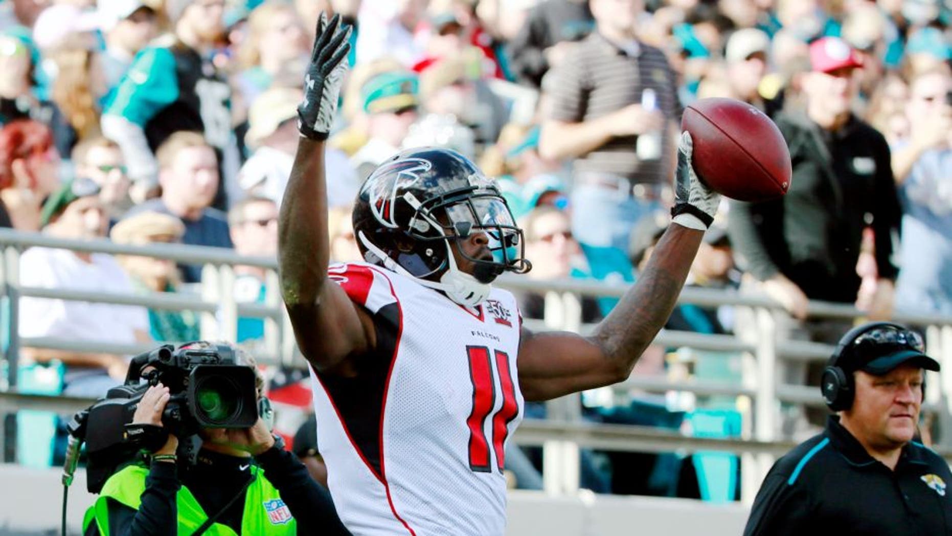 Dec 20, 2015; Jacksonville, FL, USA; Atlanta Falcons wide receiver Julio Jones (11) reacts after scoring a touchdown against the Jacksonville Jaguars during the first half at EverBank Field. Mandatory Credit: Kim Klement-USA TODAY Sports