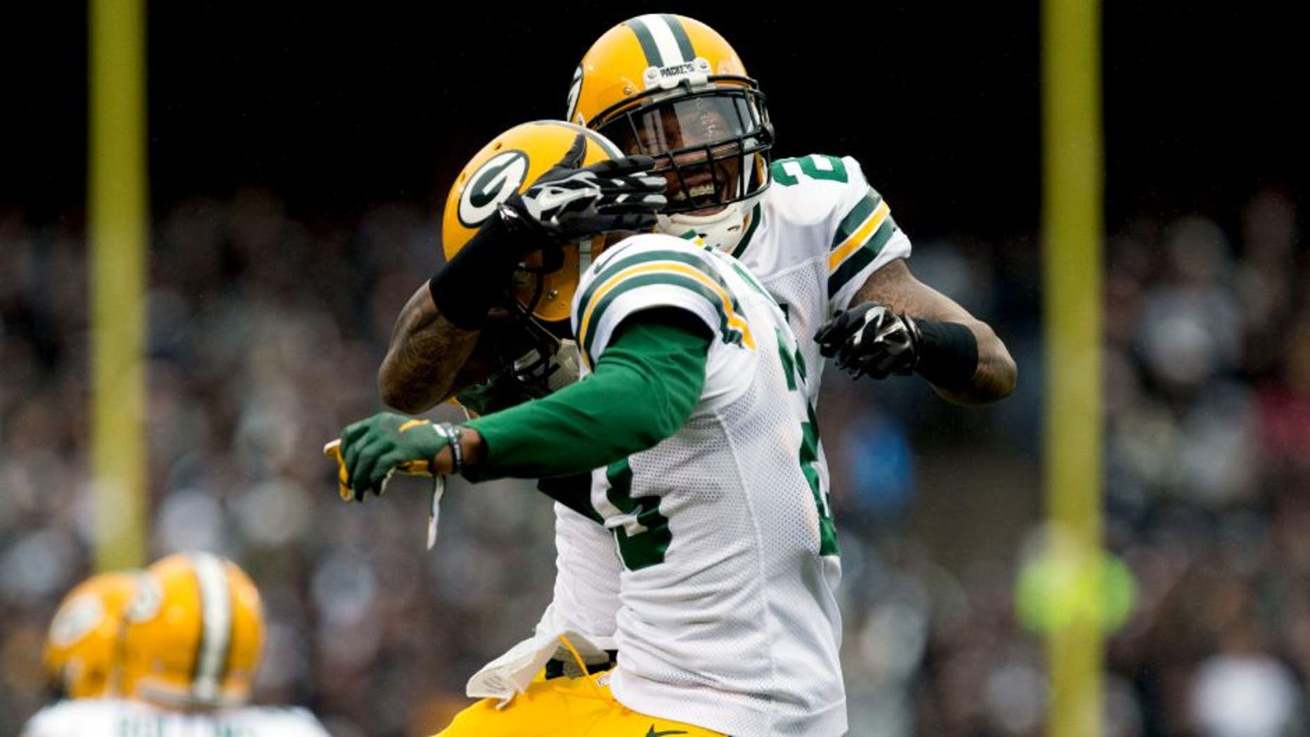 Dec 20, 2015; Oakland, CA, USA; Green Bay Packers free safety Ha Ha Clinton-Dix (21) celebrates with cornerback Damarious Randall (23) after Randall intercepted the ball and ran for a touchdown against the Oakland Raiders during the first quarter at O.co Coliseum. Mandatory Credit: Kelley L Cox-USA TODAY Sports