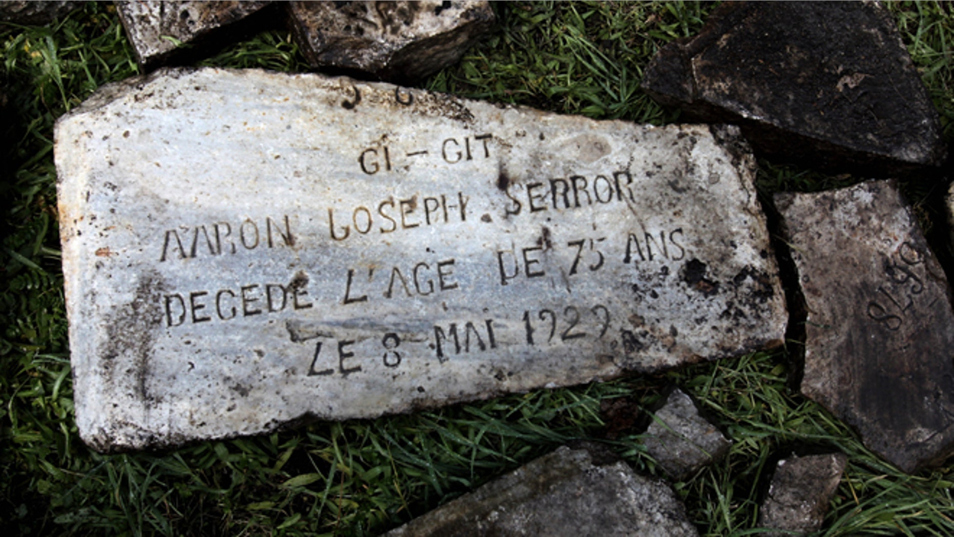 Dec. 20, 2012: Headstones destroyed during the Nazi occupation of Greece during World War II and recovered after they were found buried in a plot of land are seen on the ground at a Jewish cemetery, in the northern port city of Thessaloniki, Greece.