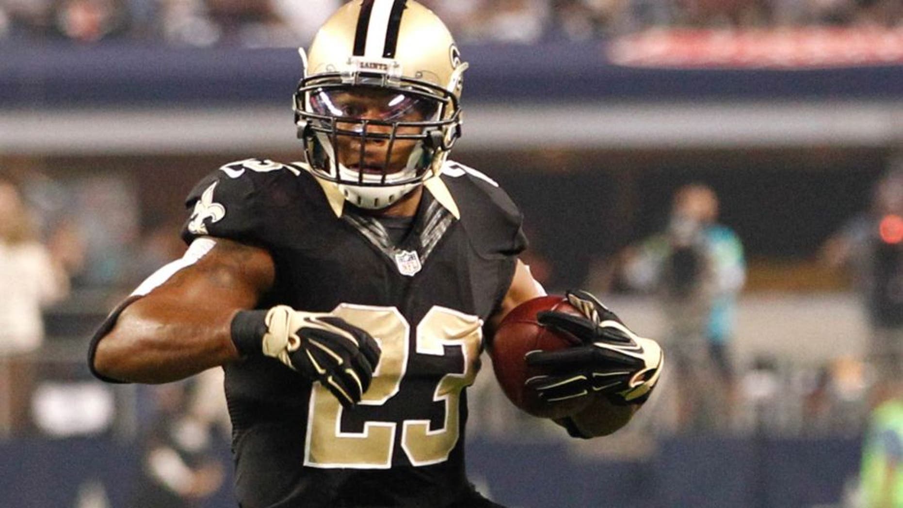 Sep 28, 2014; Arlington, TX, USA; New Orleans Saints running back Pierre Thomas (23) runs the ball against the Dallas Cowboys at AT&T Stadium. Dallas beat New Orleans 38-17. Mandatory Credit: Tim Heitman-USA TODAY Sports