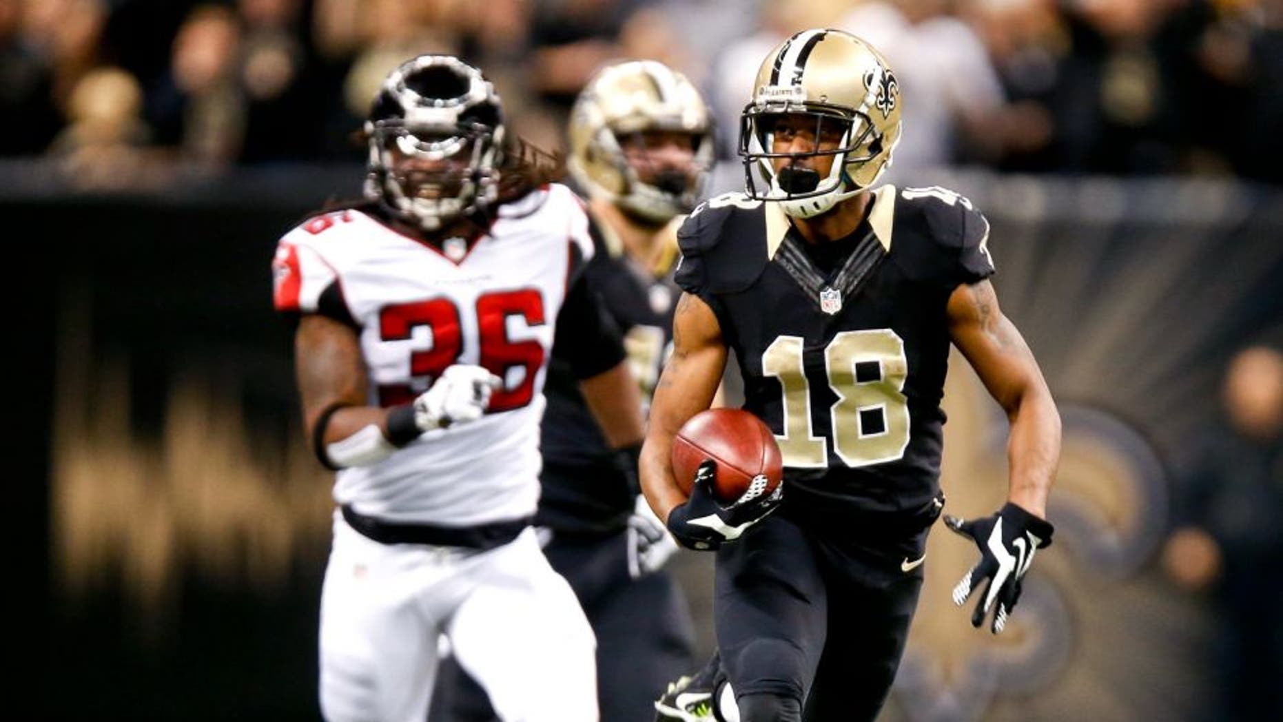 Dec 21, 2014; New Orleans, LA, USA; New Orleans Saints wide receiver Jalen Saunders (18) returns the opening kickoff as Atlanta Falcons strong safety Kemal Ishmael (36) chases during the first quarter at the Mercedes-Benz Superdome. Mandatory Credit: Derick E. Hingle-USA TODAY Sports