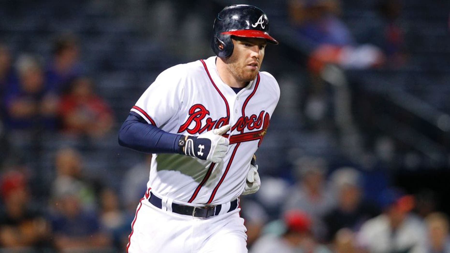Sep 10, 2015; Atlanta, GA, USA; Atlanta Braves first baseman Freddie Freeman (5) runs to first against the New York Mets in the eighth inning at Turner Field. Mandatory Credit: Brett Davis-USA TODAY Sports