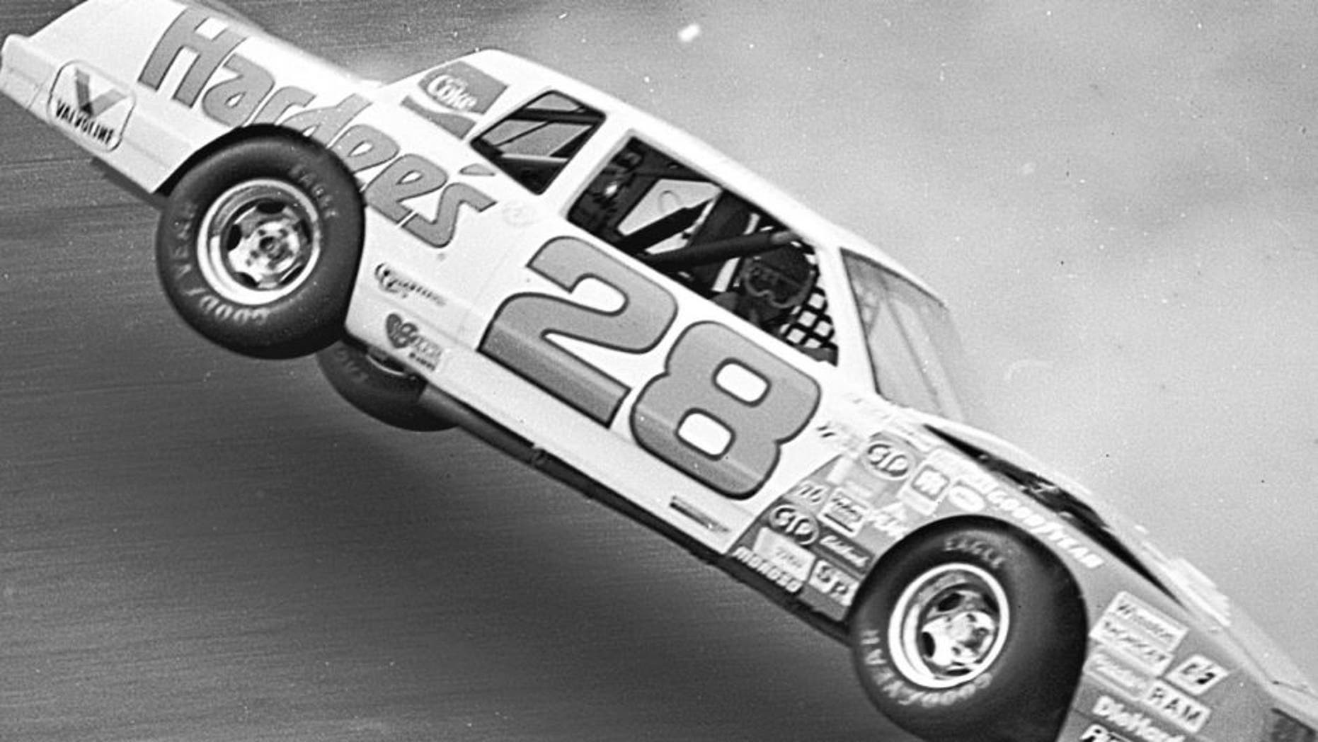 DAYTONA BEACH, FL â February 14, 1983: Cale Yarborough gazes out the passenger side window of the Hardee's Chevrolet wondering what will happen next as the car lifts in the air before rolling over during qualifying for the Daytona 500 NASCAR Cup race at Daytona International Speedway. This incident took place on Yarborough's second qualifying lap after he turned his first circuit at 200.503 mph, the first car to break the 200 mph barrier in qualifying for a Cup race at Daytona. Because he had to go to a back-up car for the race, Yarborough's first lap time was disallowed but he came back to win the Daytona 500 in his back-up machine. (Photo by ISC Images & Archives via Getty Images)