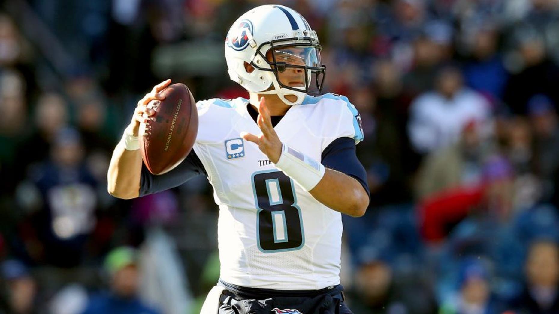 FOXBORO, MA - DECEMBER 20: Marcus Mariota #8 of the Tennessee Titans looks to pass during the first half against the New England Patriots at Gillette Stadium on December 20, 2015 in Foxboro, Massachusetts. (Photo by Jim Rogash/Getty Images)