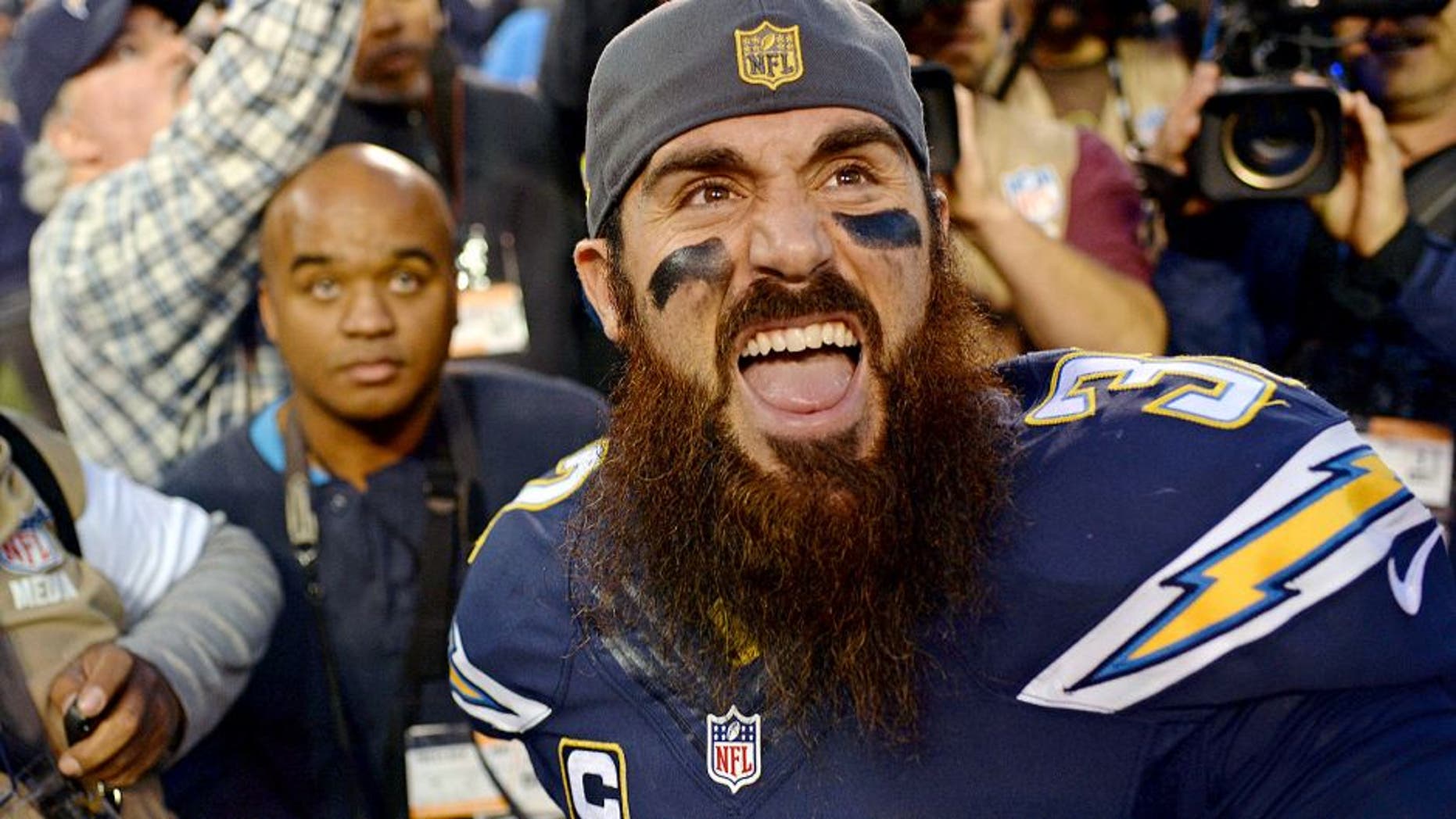 Dec 20, 2015; San Diego, CA, USA; San Diego Chargers free safety Eric Weddle (32) reacts to fans after the Chargers beat the Miami Dolphins 30-14 at Qualcomm Stadium. Mandatory Credit: Jake Roth-USA TODAY Sports