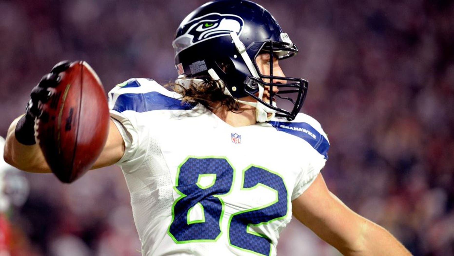 Dec 21, 2014; Glendale, AZ, USA; Seattle Seahawks tight end Luke Willson (82) celebrates a touchdown against the Arizona Cardinals during the second half at University of Phoenix Stadium. The Seahawks won 35-6. Mandatory Credit: Joe Camporeale-USA TODAY Sports
