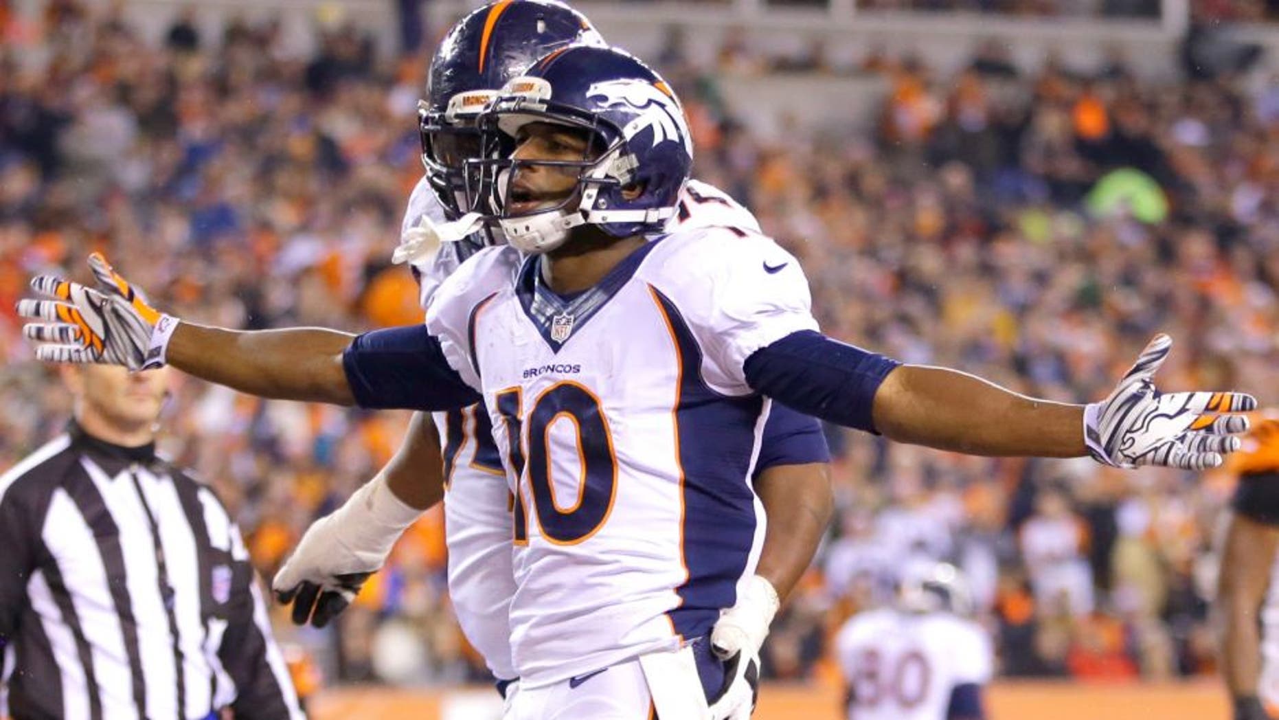 Denver Broncos wide receiver Emmanuel Sanders (10) reacts following a 4-yard touchdown reception during the second half of an NFL football game against the Cincinnati Bengals Monday, Dec. 22, 2014, in Cincinnati. (AP Photo/AJ Mast)