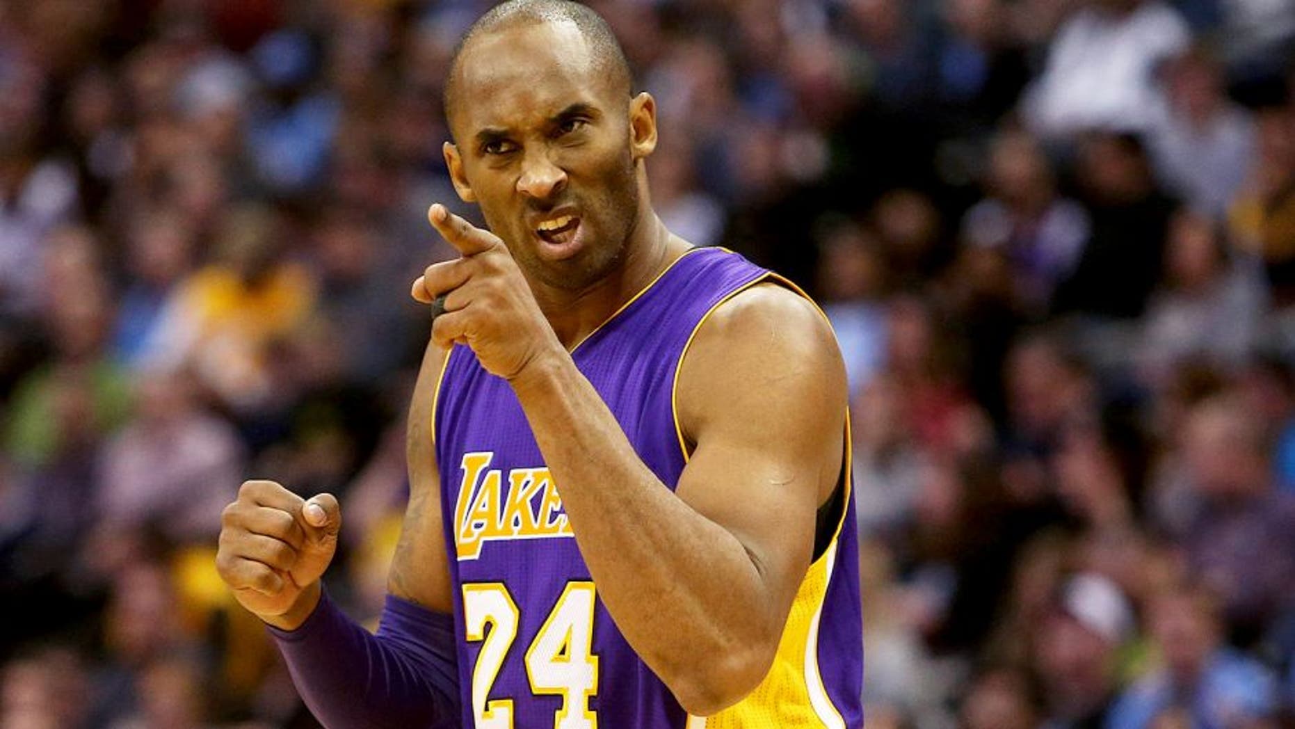 Dec 22, 2015; Denver, CO, USA; Los Angeles Lakers forward Kobe Bryant (24) reacts during the second half against the Denver Nuggets at Pepsi Center. The Lakers won 111-107. Mandatory Credit: Chris Humphreys-USA TODAY Sports