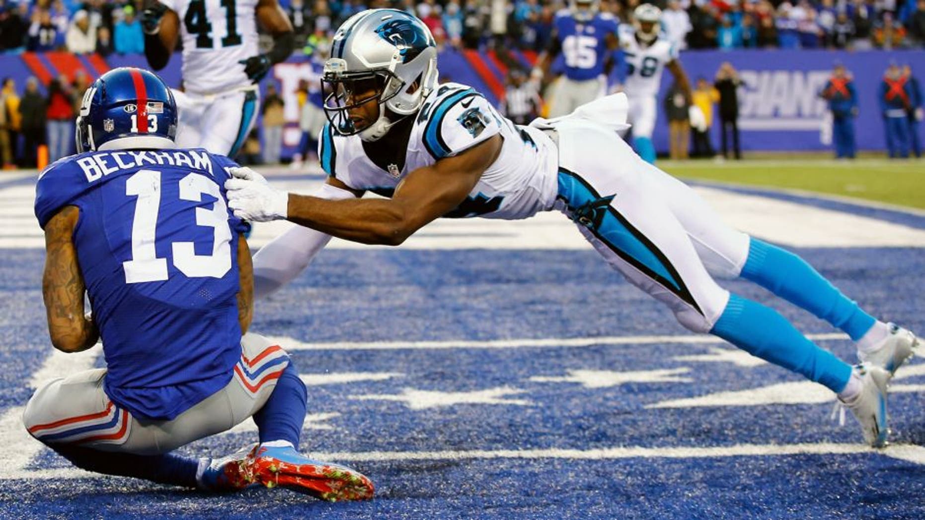 EAST RUTHERFORD, NJ - DECEMBER 20: Odell Beckham #13 of the New York Giants scores a game tying touchdown against Josh Norman #24 of the Carolina Panthers in the fourth Quarter during their game at MetLife Stadium on December 20, 2015 in East Rutherford, New Jersey. (Photo by Al Bello/Getty Images)