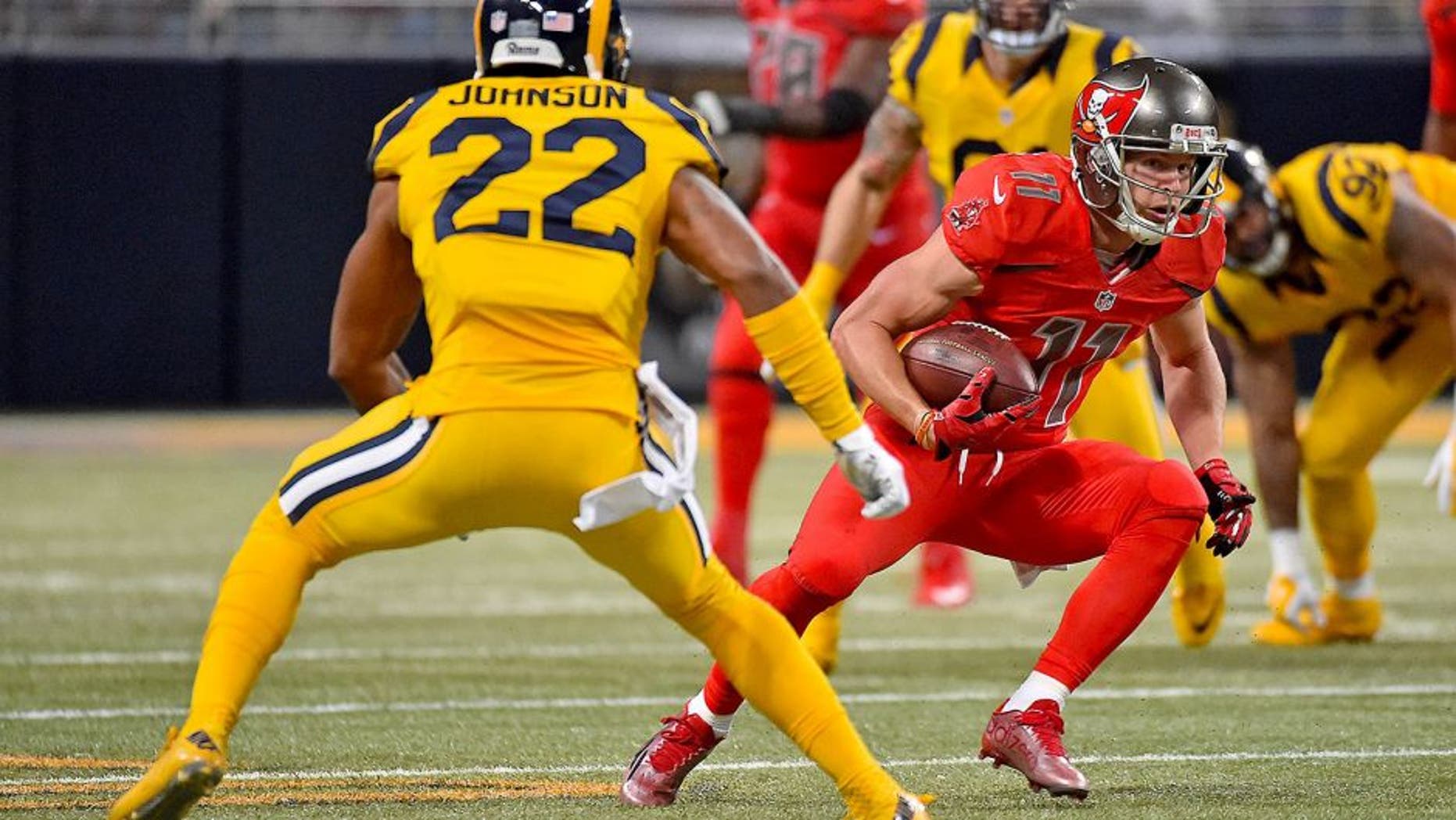 Dec 17, 2015; St. Louis, MO, USA; Tampa Bay Buccaneers wide receiver Adam Humphries (11) runs the ball against St. Louis Rams cornerback Trumaine Johnson (22) during the second half at the Edward Jones Dome. Mandatory Credit: Jasen Vinlove-USA TODAY Sports