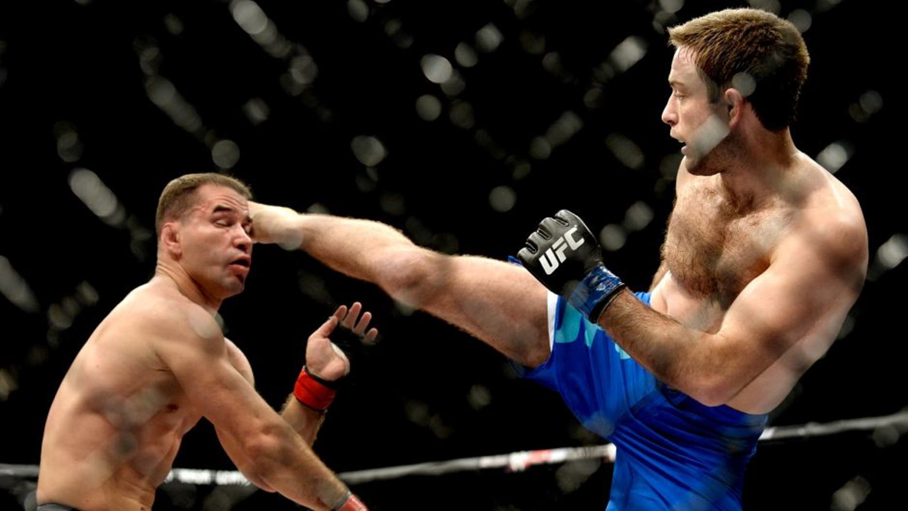 LAS VEGAS, NV - DECEMBER 11: (R-L) Ryan Hall kicks Artem Lobov in their lightweight finals bout during the TUF Finale event inside The Chelsea at The Cosmopolitan of Las Vegas on December 11, 2015 in Las Vegas, Nevada. (Photo by Brandon Magnus/Zuffa LLC/Zuffa LLC via Getty Images)