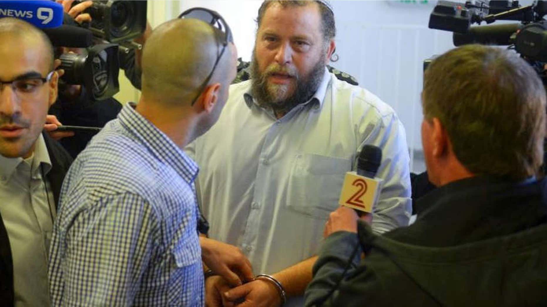 Dec. 16, 2014: Bentzi Gopstein, leader of the extreme right-wing movement Lehava, is handcuffed as he arrives for his hearing at a Jerusalem Court.