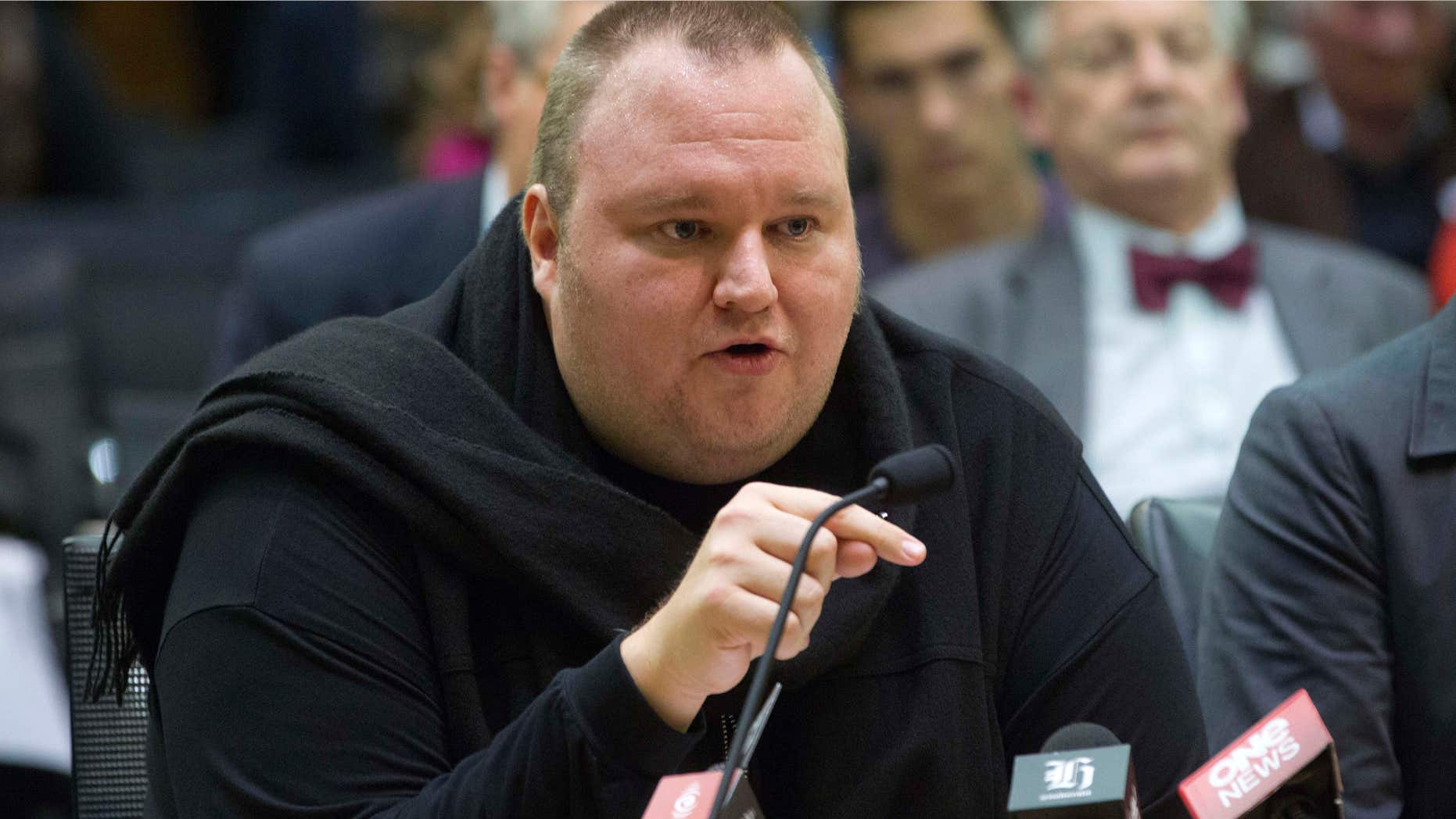FILE - In this Wednesday, July 3, 2013 file photo, Internet entrepreneur Kim Dotcom speaks during the Intelligence and Security select committee hearing at Parliament in Wellington, New Zealand.