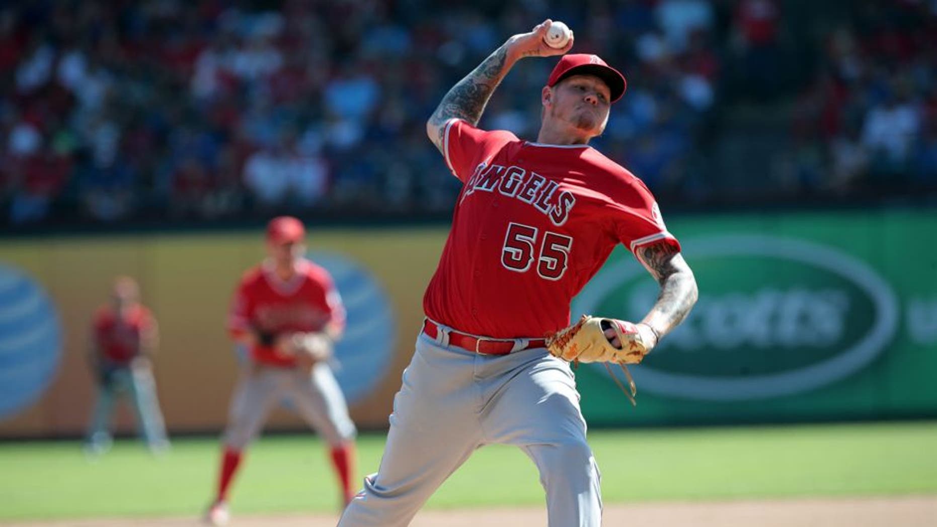 ARLINGTON, TX - OCTOBER 3: Mat Latos #55 of the Los Angeles Angels of Anaheim throws in the seventh inning against the Los A at Rangers Global Life Park in Arlington on October 3, 2015 in Arlington, Texas. (Photo by Rick Yeatts/Getty Images)