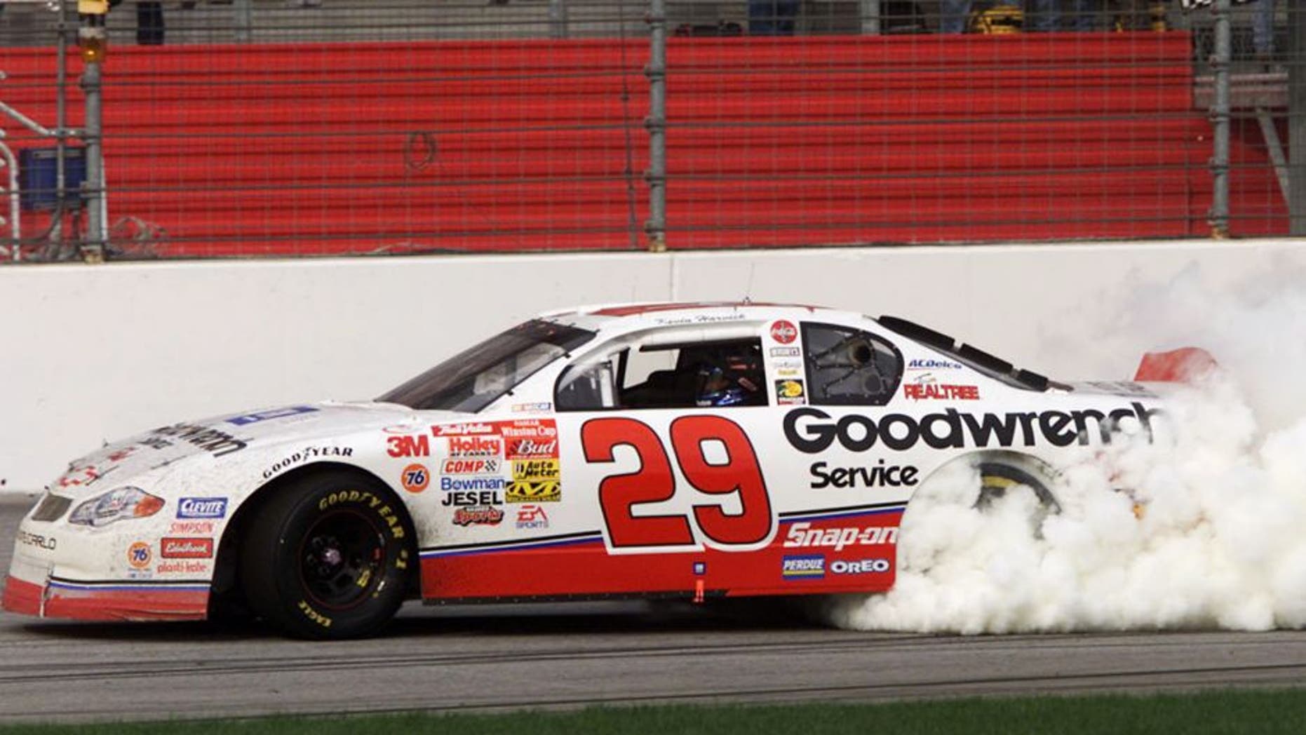 11 Mar 2001: Kevin Harvick in the #29 Childres Racing Chevrolet Monte Carlo celebrates by doing donuts after winning the Winston Cup Cracker Barrel 500 at Atlanta Motorspeedway in Hampton, Georgia. Digital Image. Mandatory Credit: Jonathan Ferrey/ALLSPORT