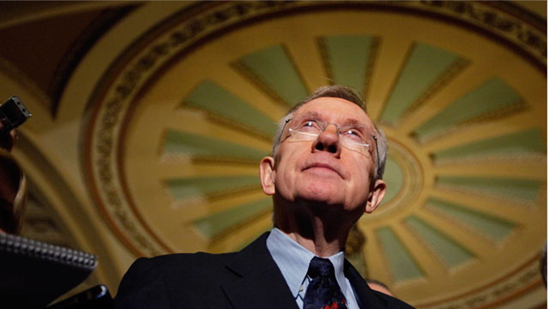 Dec. 24: Senate Majority Leader Harry Reid listens to questions following the passage of the Senate health care bill.