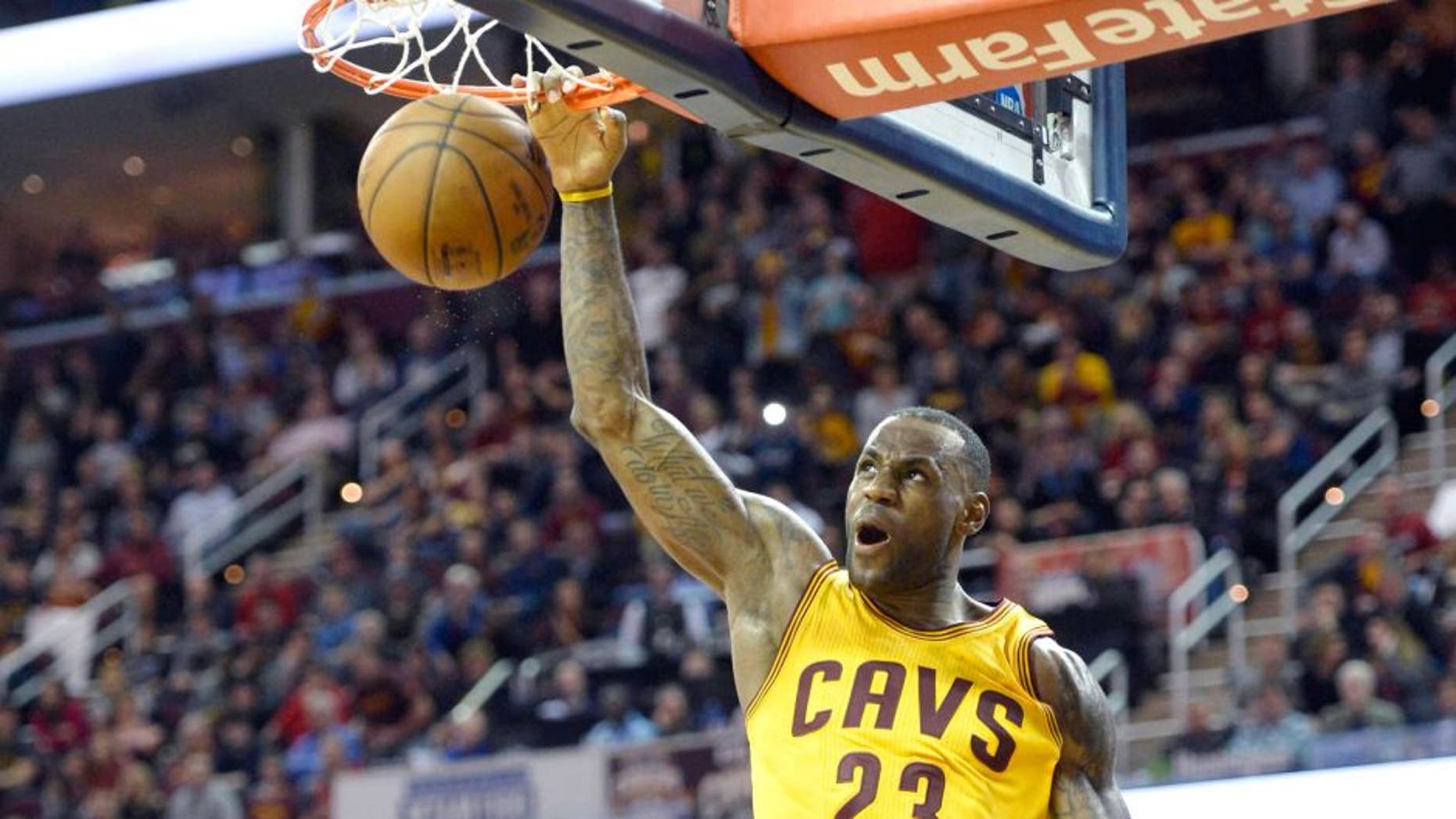 Dec 23, 2015; Cleveland, OH, USA; Cleveland Cavaliers forward LeBron James (23) dunks against the New York Knicks in the fourth quarter at Quicken Loans Arena. Mandatory Credit: David Richard-USA TODAY Sports