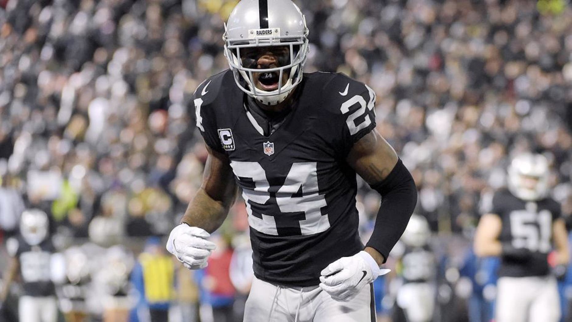 Dec 24, 2015; Oakland, CA, USA; Oakland Raiders free safety Charles Woodson (24) reacts during an NFL football game against the San Diego Chargers at O.co Coliseum. Mandatory Credit: Kirby Lee-USA TODAY Sports