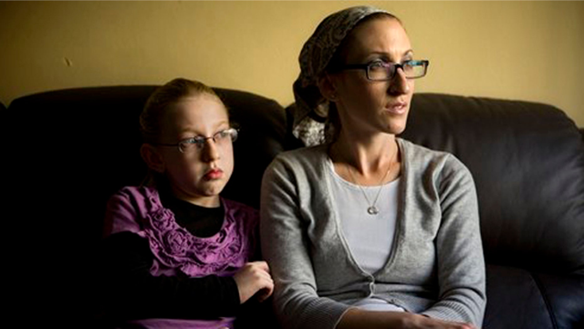December 26, 2011: Naama Margolese, 8, sits with her mother Hadassa in their home in the central Israeli town of Beit Shemesh.