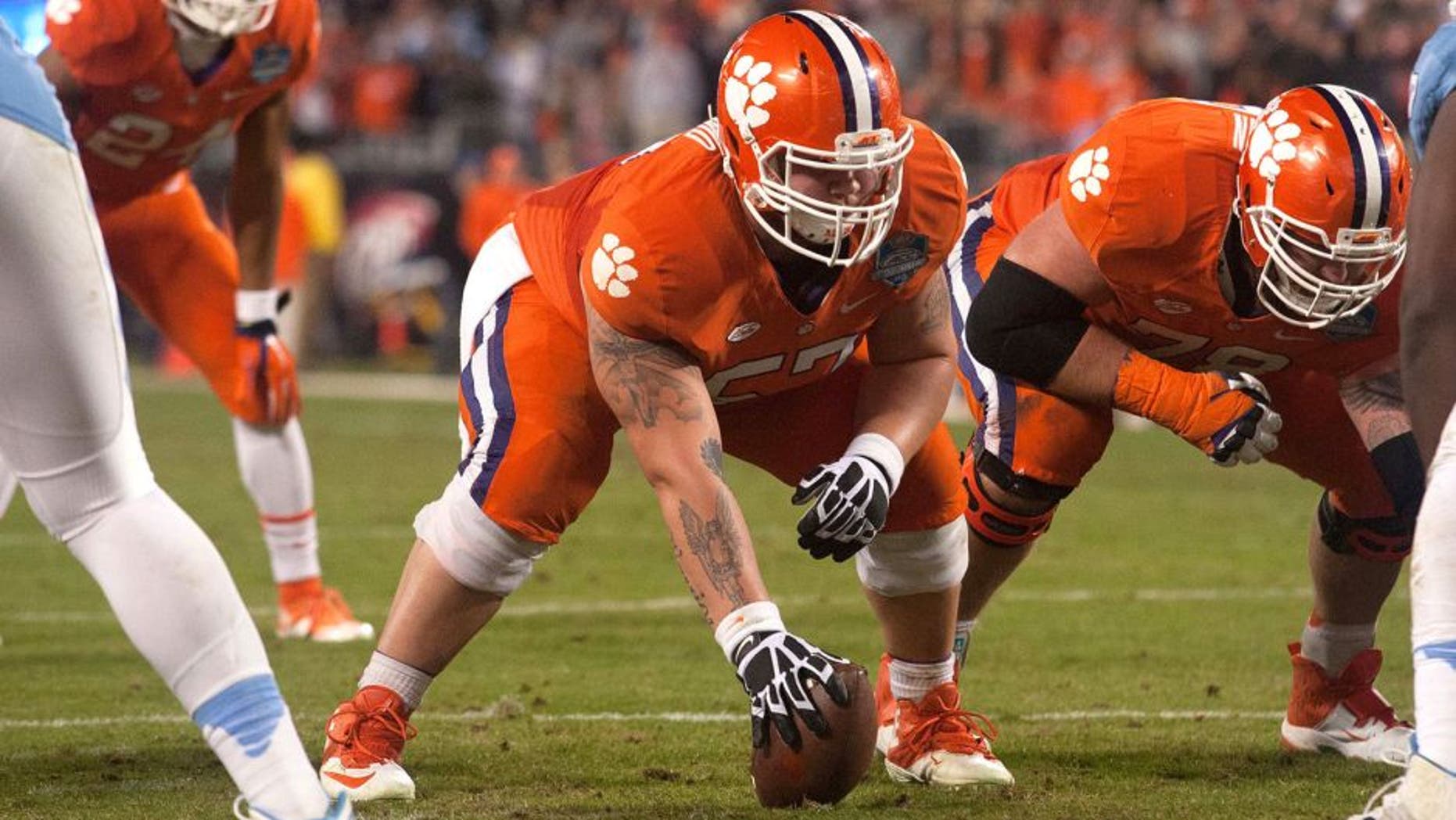 Dec 5, 2015; Charlotte, NC, USA; Clemson Tigers center Jay Guillermo (57) prepares to snap the ball during the second half against the North Carolina Tar Heels in the ACC football championship game at Bank of America Stadium. Clemson defeated North Carolina 45-37. Mandatory Credit: Jeremy Brevard-USA TODAY Sports