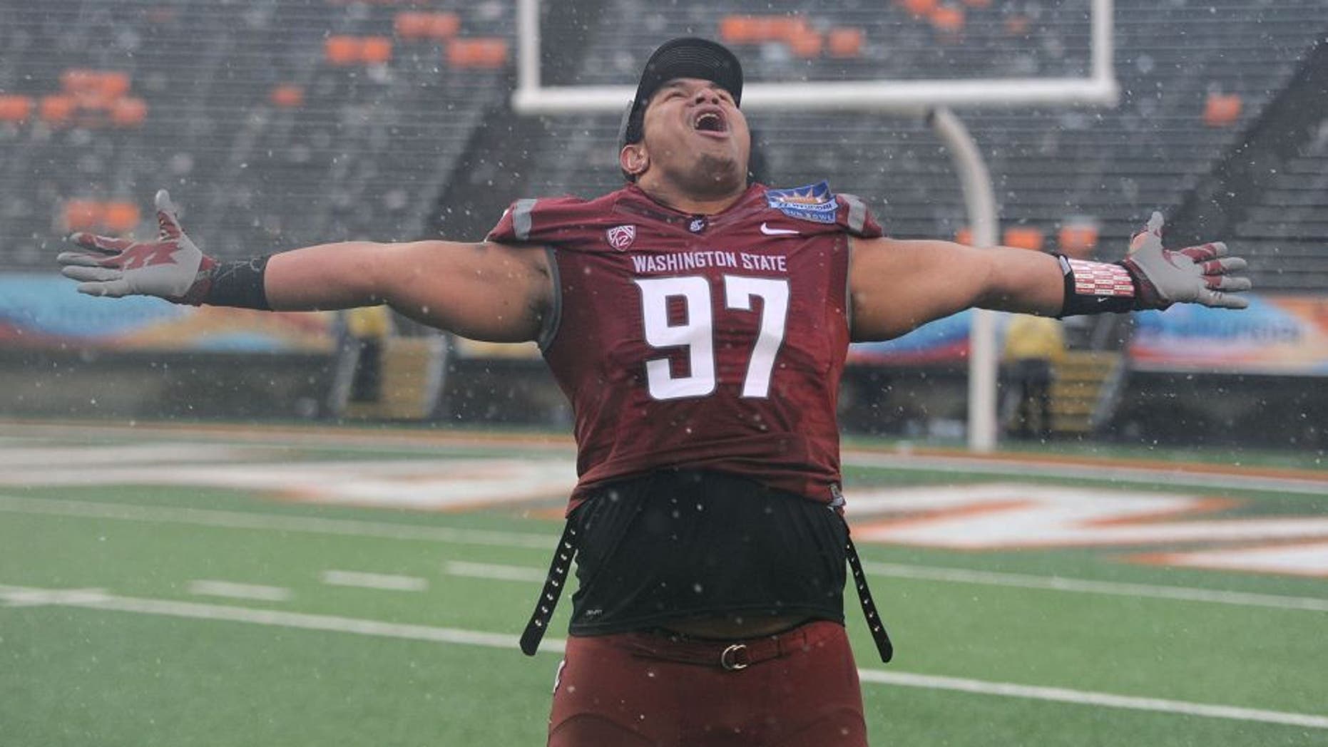 Dec 26, 2015; El Paso, TX, USA; Washington State Cougars defensive lineman Destiny Vaeao (97) reacts after the second half against the Miami Hurricanes at Sun Bowl Stadium. The Cougars won 20-14. Mandatory Credit: Joe Camporeale-USA TODAY Sports