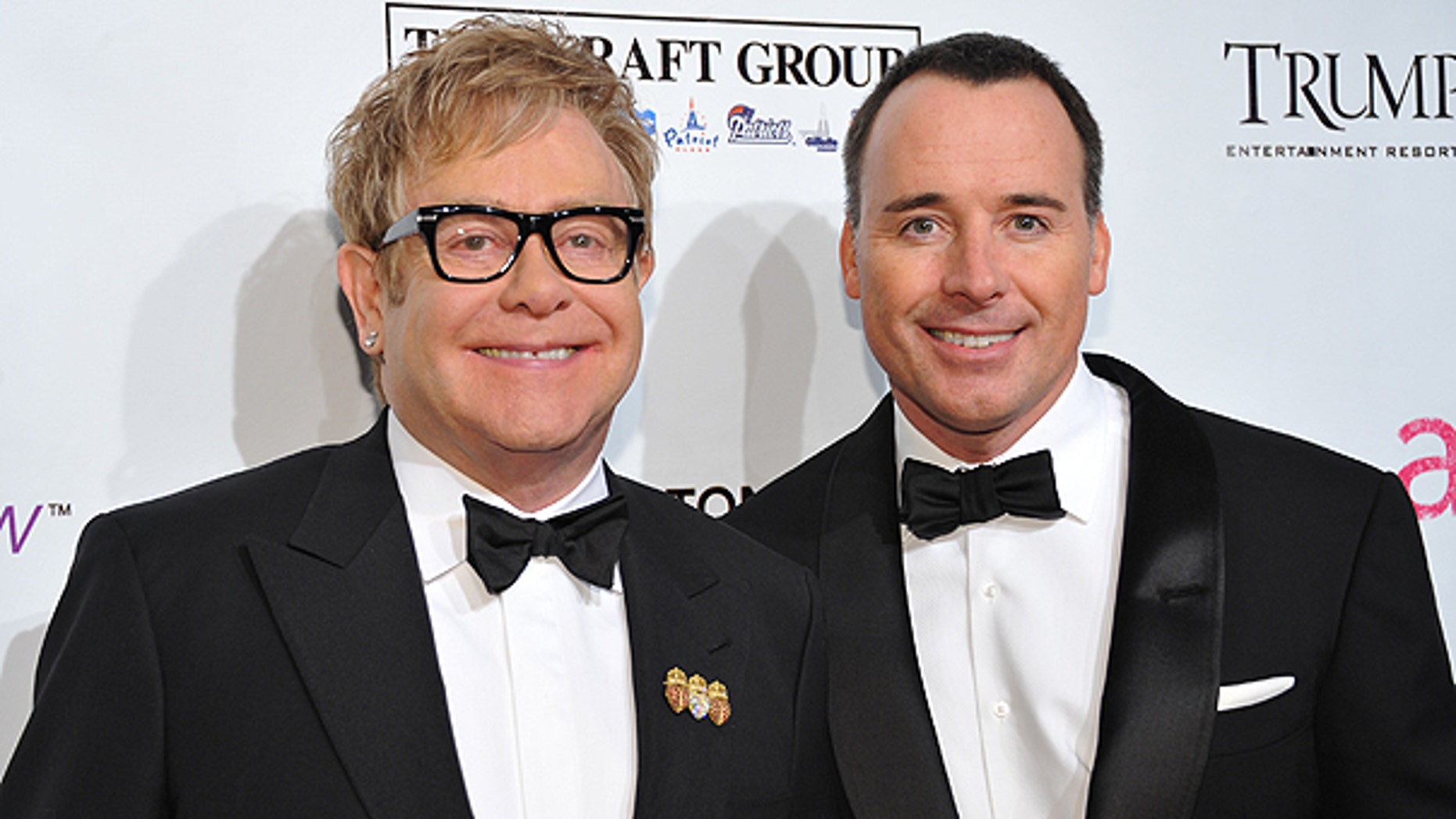 In this Oct. 18, 2010 file photo, Sir Elton John, left, and husband David Furnish attend the Ninth Annual Elton John AIDS Foundation benefit 'An Enduring Vision' at Cipriani Wall Street in New York.