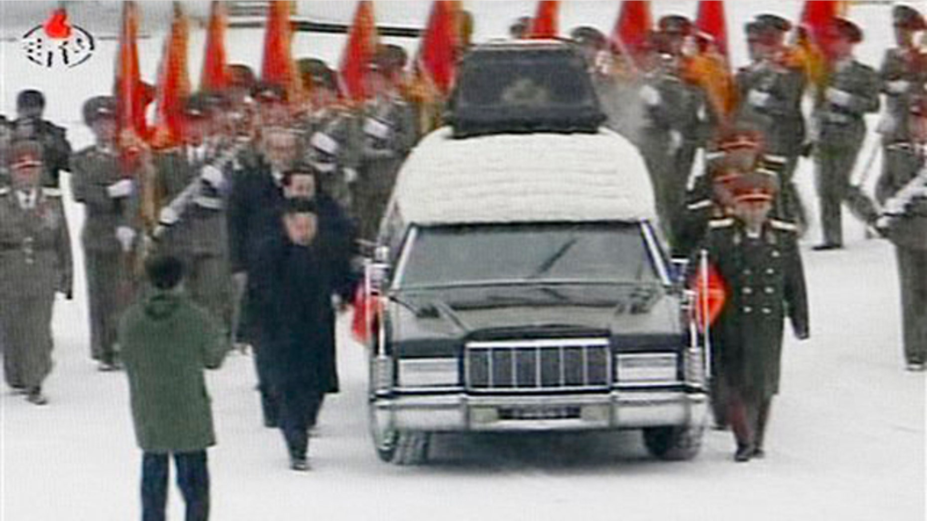 December 28, 2011: In this image made from KRT television, a hearse is driven during a funeral procession of late North Korean leader Kim Jong Il in the snow in Pyongyang, North Korea.