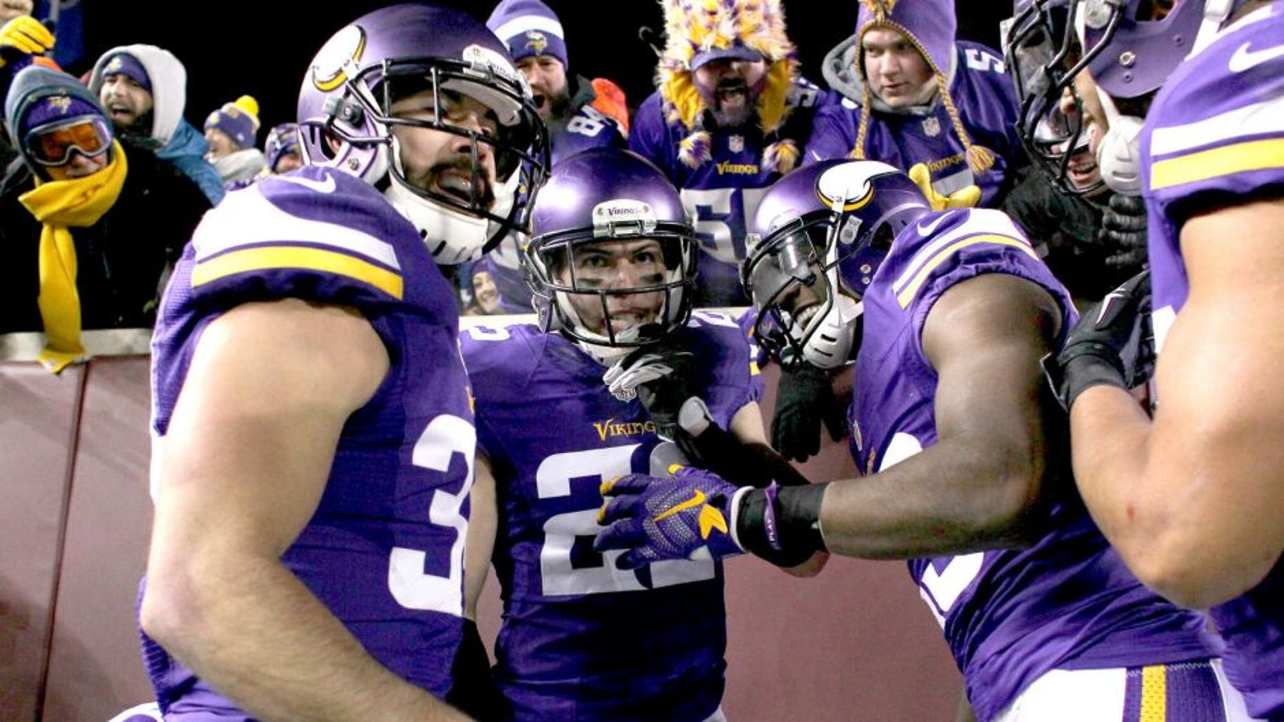 MINNEAPOLIS, MN - DECEMBER 27: Harrison Smith #22 of the Minnesota Vikings and teammates celebrate Smith's interception for a touchdown in the second quarter against the New York Giants on December 27, 2015 at TCF Bank Stadium in Minneapolis, Minnesota. (Photo by Adam Bettcher/Getty Images)
