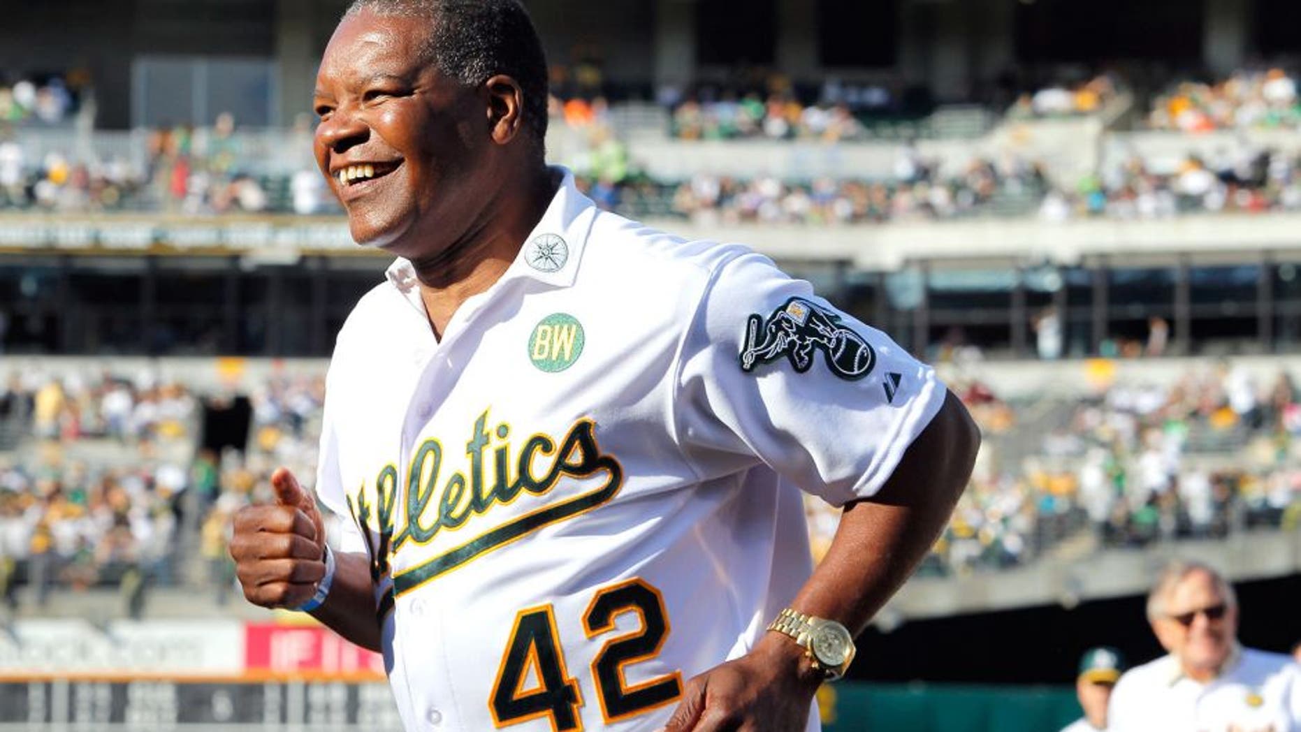 OAKLAND, CA - JULY 19: Dave Henderson #42 of the 1989 Oakland A's joins his teammates as they celebrate their World Series championship 25 years ago against the San Francisco Giants before a game at O.co Coliseum on July 19, 2014 in Oakland, California. (Photo by Brian Bahr/Getty Images)