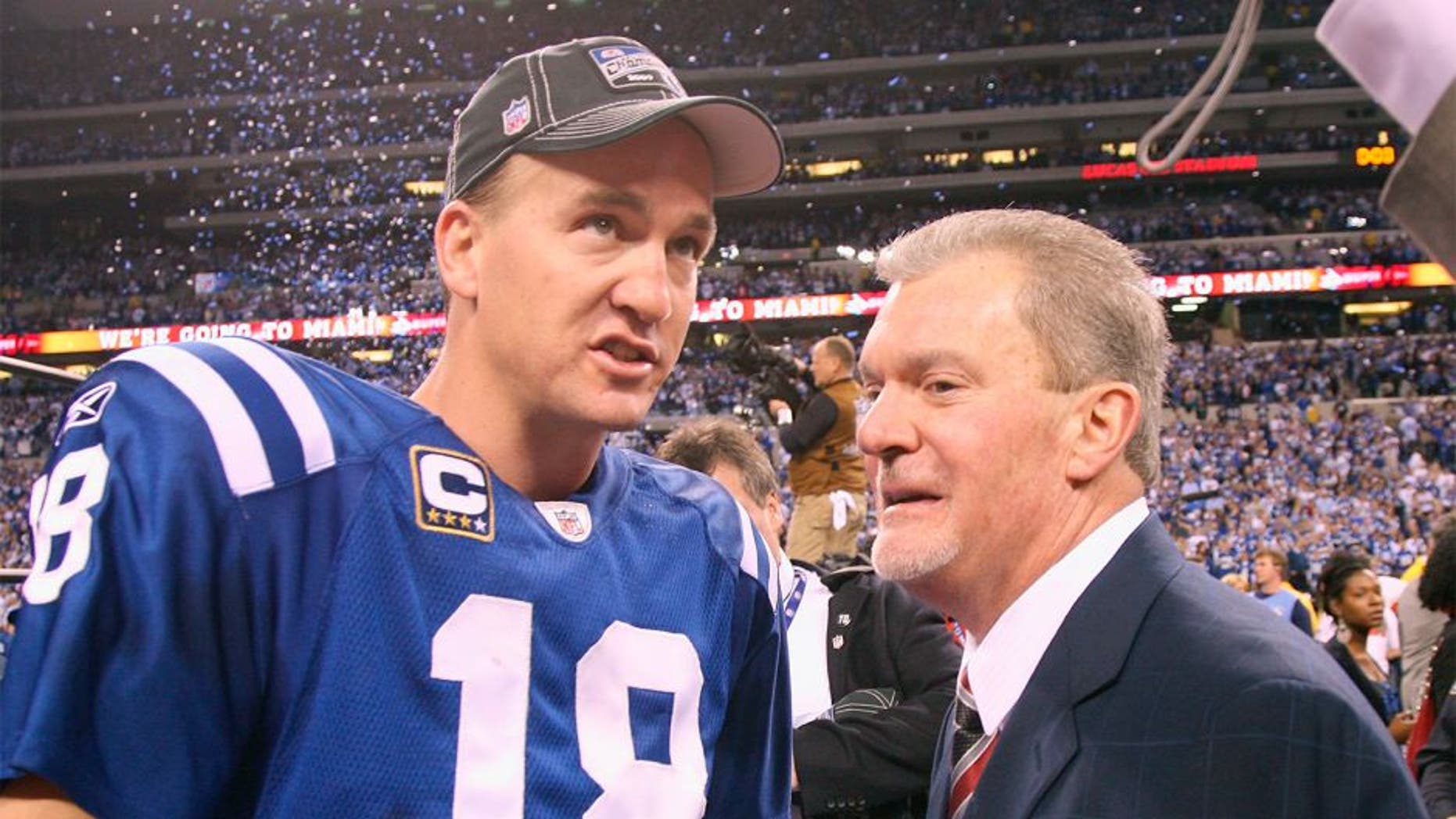 INDIANAPOLIS - JANUARY 24: Quarterback Peyton Manning #18 of the Indianapolis Colts celebrates the victory with owner Jim Irsay when the Indianapolis Colts host the New York Jets in the AFC Championship Game at Lucas Oil Stadium on January 24, 2010 in Indianapolis, Indiana. Colts beat the Jets, 30-17, to advance tot he Super Bowl. (Photo by Al Pereira/Getty Images)