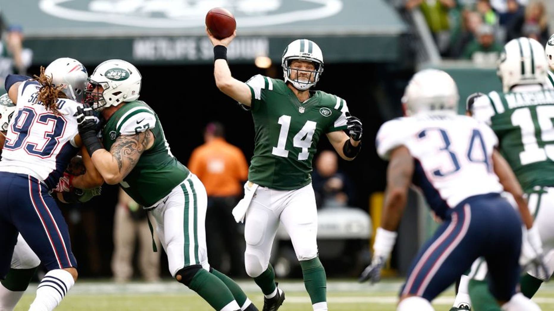 EAST RUTHERFORD, NJ - DECEMBER 27: Ryan Fitzpatrick #14 of the New York Jets throws a pass in the first quarter against the New England Patriots during their game at MetLife Stadium on December 27, 2015 in East Rutherford, New Jersey. (Photo by Jeff Zelevansky/Getty Images)