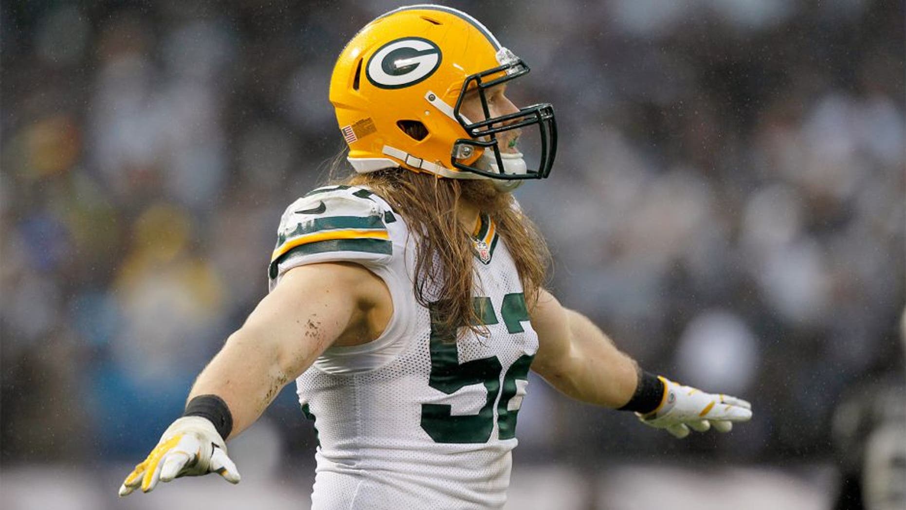 Dec 20, 2015; Oakland, CA, USA; Green Bay Packers inside linebacker Clay Matthews (52) reacts after the Packers made a defensive stop on fourth down against the Oakland Raiders in the fourth quarter at O.co Coliseum. The Packers defeated the Raiders 30-20. Mandatory Credit: Cary Edmondson-USA TODAY Sports