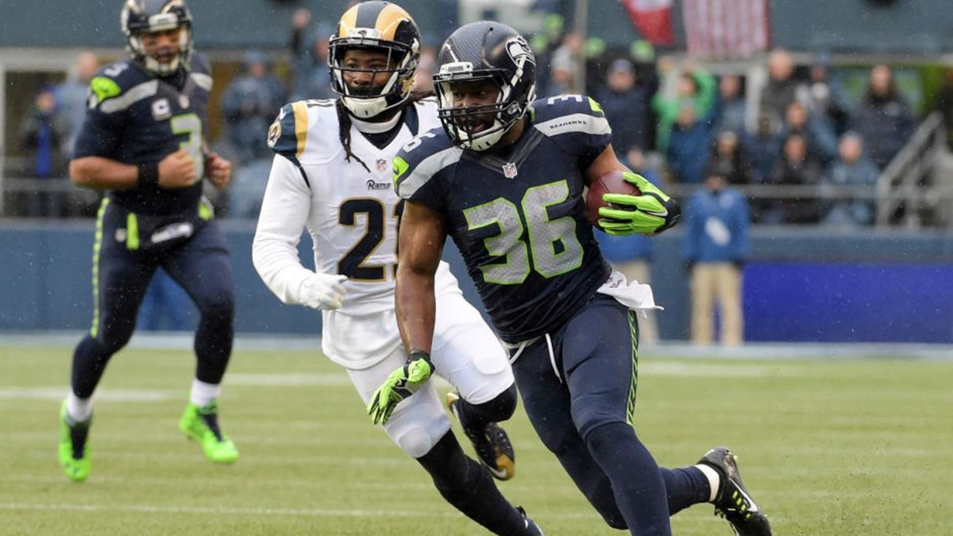 Dec 27, 2015; Seattle, WA, USA; Seattle Seahawks running back Bryce Brown (36) is defended by St. Louis Rams cornerback Trumaine Johnson (22) during an NFL football game at CenturyLink Field. Mandatory Credit: Kirby Lee-USA TODAY Sports