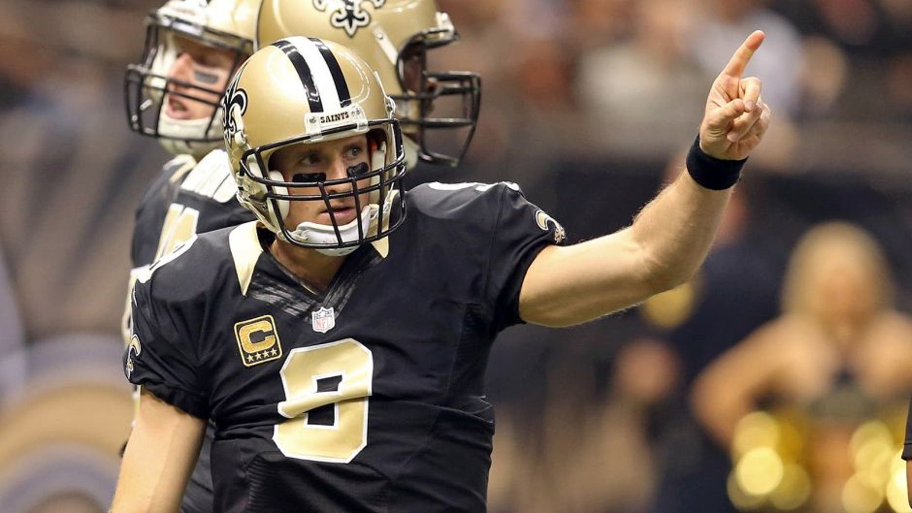 Dec 27, 2015; New Orleans, LA, USA; New Orleans Saints quarterback Drew Brees (9) gestures during the first quarter of their game against the Jacksonville Jaguars at the Mercedes-Benz Superdome. Mandatory Credit: Chuck Cook-USA TODAY Sports
