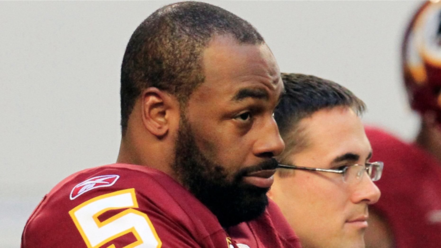FILE: Then-Washington Redskins quarterback Donovan McNabb stands on the sidelines before an NFL football game against the Dallas Cowboys in Arlington, Texas.