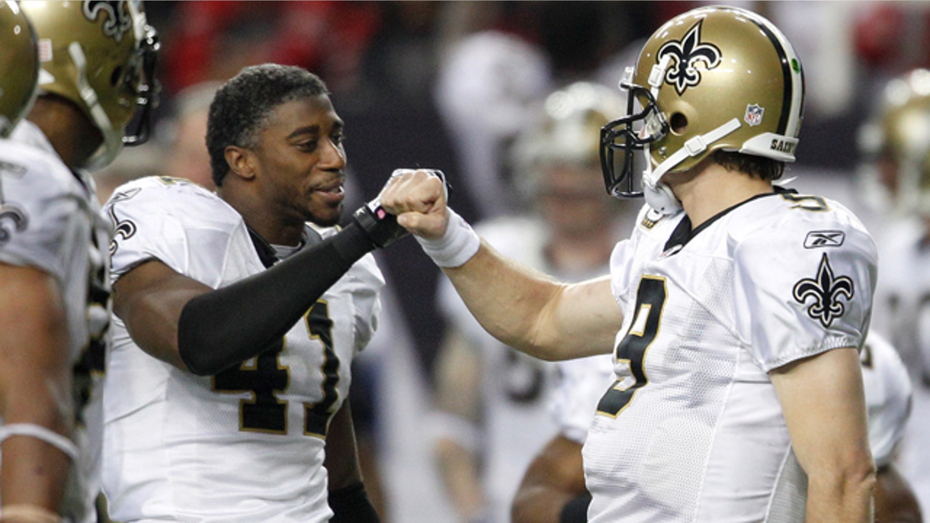 New Orleans Saints quarterback Drew Brees, right, celebrates with Roman Harper (41) in the final seconds of an NFL football game against the Atlanta Falcons on Monday, Dec. 27, 2010, in Atlanta. New Orleans won 17-14. (AP Photo/David Goldman)
