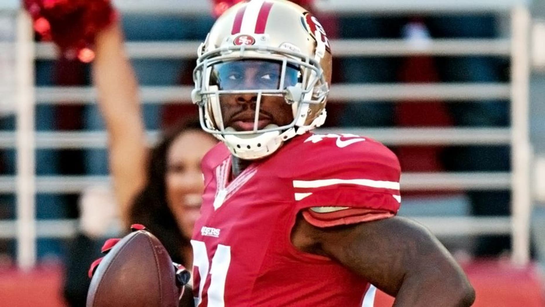 Dec 28, 2014; Santa Clara, CA, USA; San Francisco 49ers wide receiver Anquan Boldin (81) looks over his shoulder while scoring a touchdown during the first quarter against the Arizona Cardinals at Levi's Stadium. Mandatory Credit: Ed Szczepanski-USA TODAY Sports
