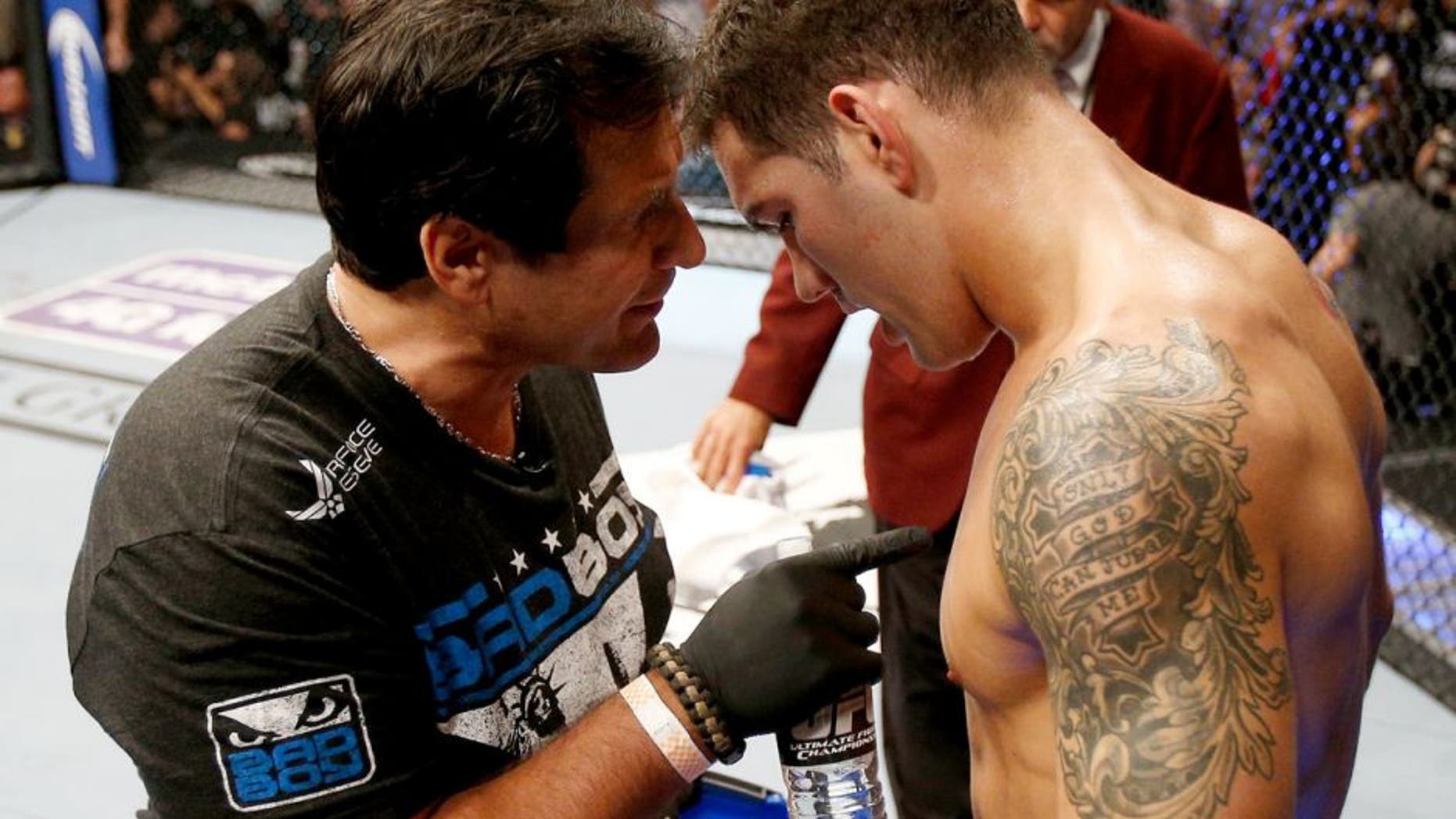 LAS VEGAS, NV - JULY 06: (L-R) Coach Ray Longo provides instruction to Chris Weidman between rounds of his UFC middleweight championship fight against Anderson Silva during the UFC 162 event inside the MGM Grand Garden Arena on July 6, 2013 in Las Vegas, Nevada. (Photo by Josh Hedges/Zuffa LLC/Zuffa LLC via Getty Images)