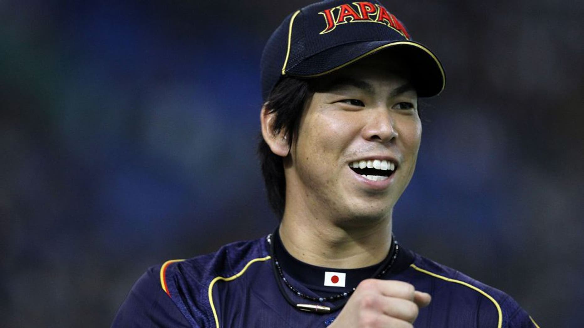 TOKYO, JAPAN - MARCH 10: Pitcher Kenta Maeda #20 of Japan celebrates after in the bottom half of the second inning during the World Baseball Classic Second Round Pool 1 game between Japan and the Netherlands at Tokyo Dome on March 10, 2013 in Tokyo, Japan. (Photo by Koji Watanabe/Getty Images)