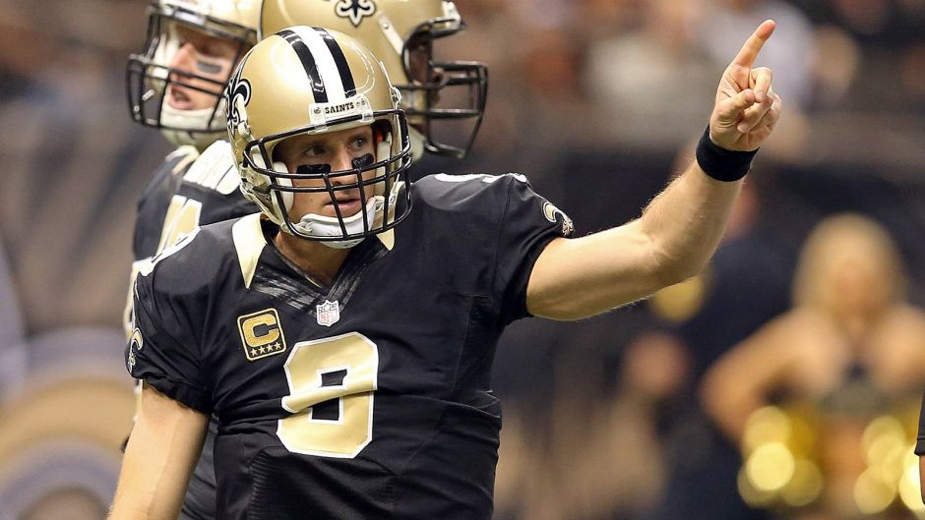 Dec 27, 2015; New Orleans, LA, USA; New Orleans Saints quarterback Drew Brees (9) gestures during the first quarter of their game against the Jacksonville Jaguars at the Mercedes-Benz Superdome. Mandatory Credit: Chuck Cook-USA TODAY Sports