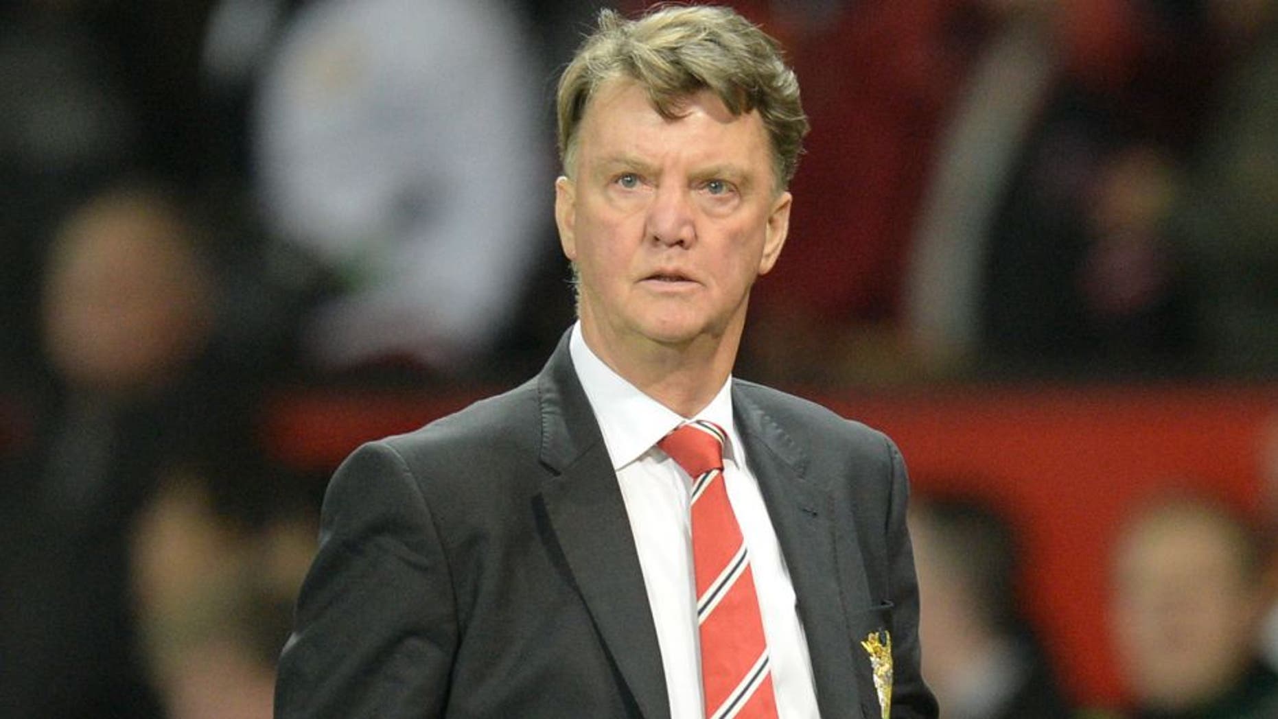 Manchester United's Dutch manager Louis van Gaal leaves the pitch after the final whistle of the English Premier League football match between Manchester United and Chelsea at Old Trafford in Manchester, north west England, on December 28, 2015. AFP PHOTO / OLI SCARFF RESTRICTED TO EDITORIAL USE. No use with unauthorized audio, video, data, fixture lists, club/league logos or 'live' services. Online in-match use limited to 75 images, no video emulation. No use in betting, games or single club/league/player publications. / AFP / OLI SCARFF (Photo credit should read OLI SCARFF/AFP/Getty Images)
