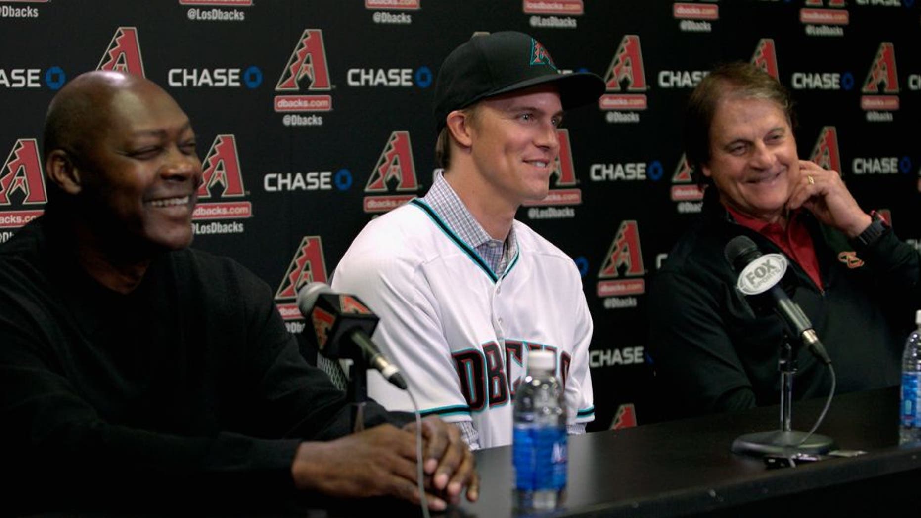 PHOENIX, AZ - DECEMBER 11: Free agent aquisition Zack Greinke of the Arizona Diamondbacks (C) laughs with Chief Baseball Officer Tony La Russa (R) and General Manager Dave Stewart during a press conference at Chase Field on December 11, 2015 in Phoenix, Arizona. (Photo by Ralph Freso/Getty Images)