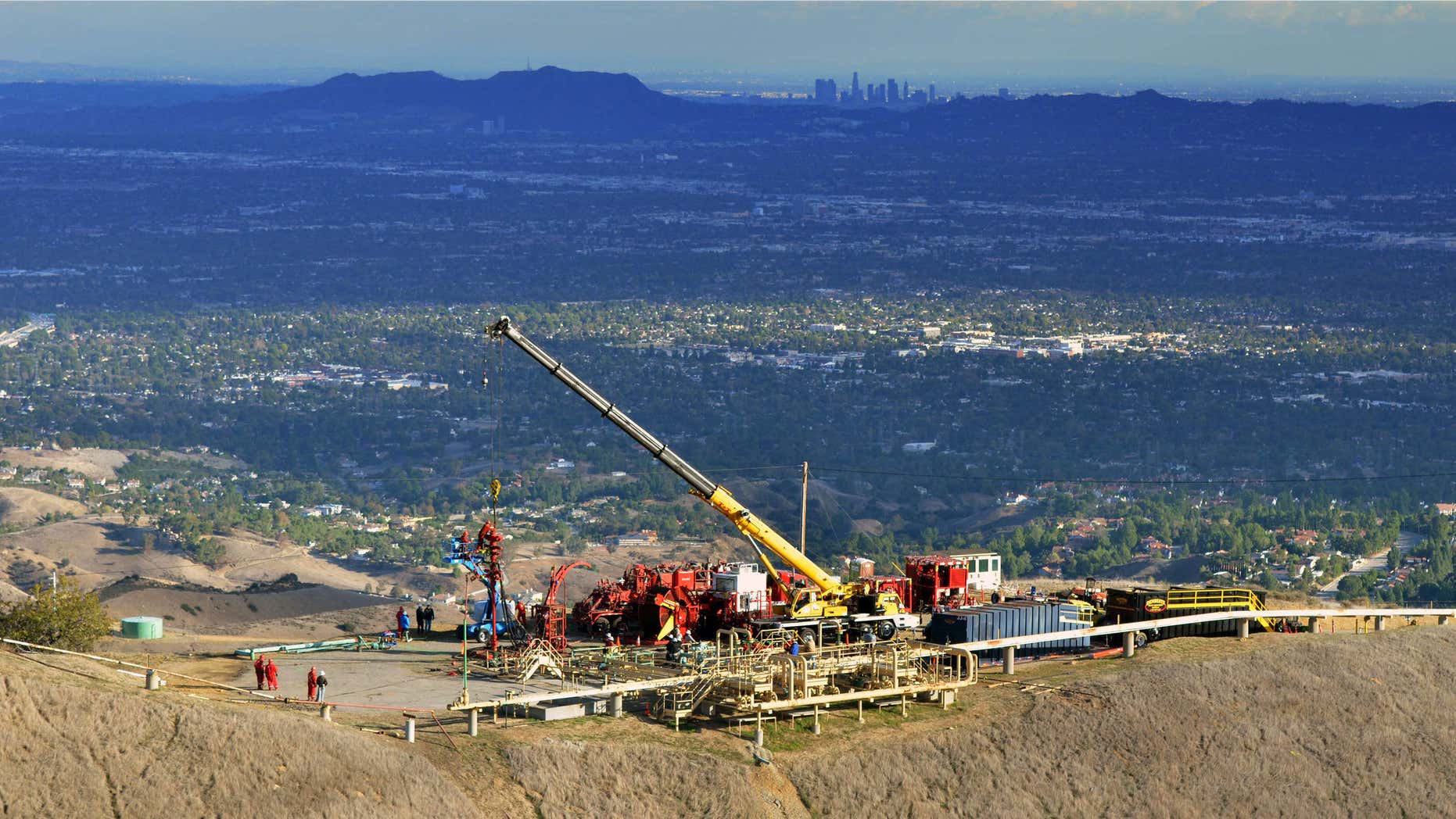 FILE- This Nov. 3, 2015, file photo provided by Southern California Gas Co., shows equipment being used as SoCalGas crews and technical experts attempt to safely stop the flow of natural gas leaking from a storage well at the utility’s Aliso Canyon facility near Northridge section of Los Angeles.