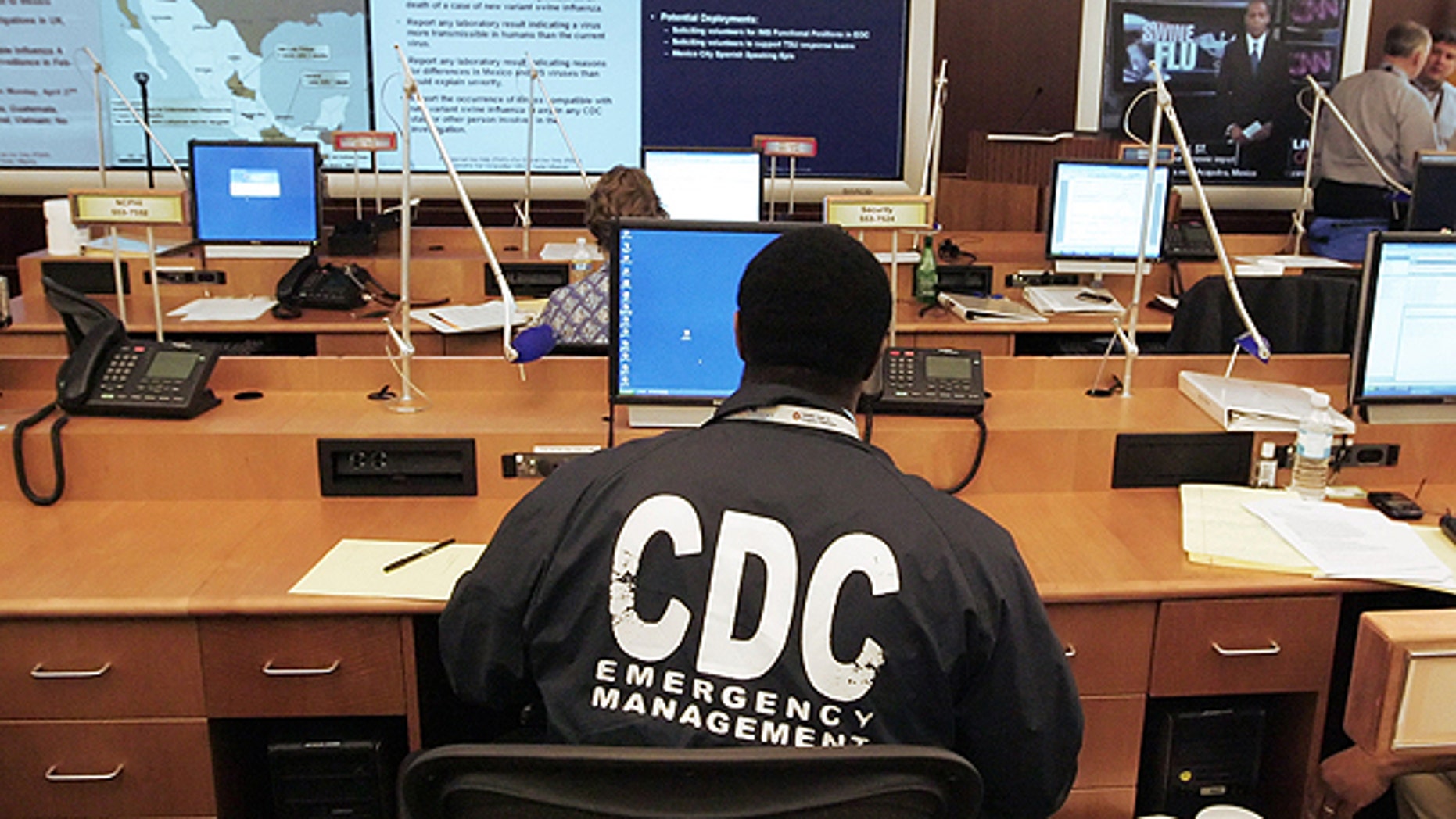 A worker at the Center for Disease Control and Prevention sits at a station in the emergency operations center as the CDC monitors swine flu development in this April 27, 2009 file photo taken in Atlanta.