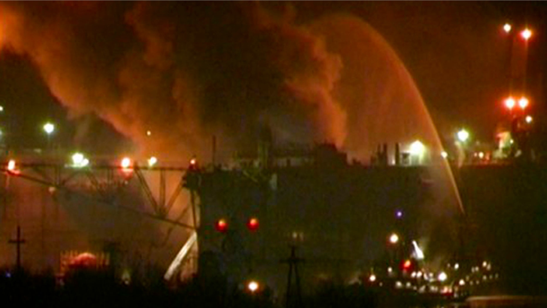 December 29, 2011: In this framegrab image from Ru-RTR Russian state channel, smoke rises from a dock where the Yekaterinburg nuclear submarine is for repairs at the Roslyakovo shipyard in the Murmansk region, Russia.