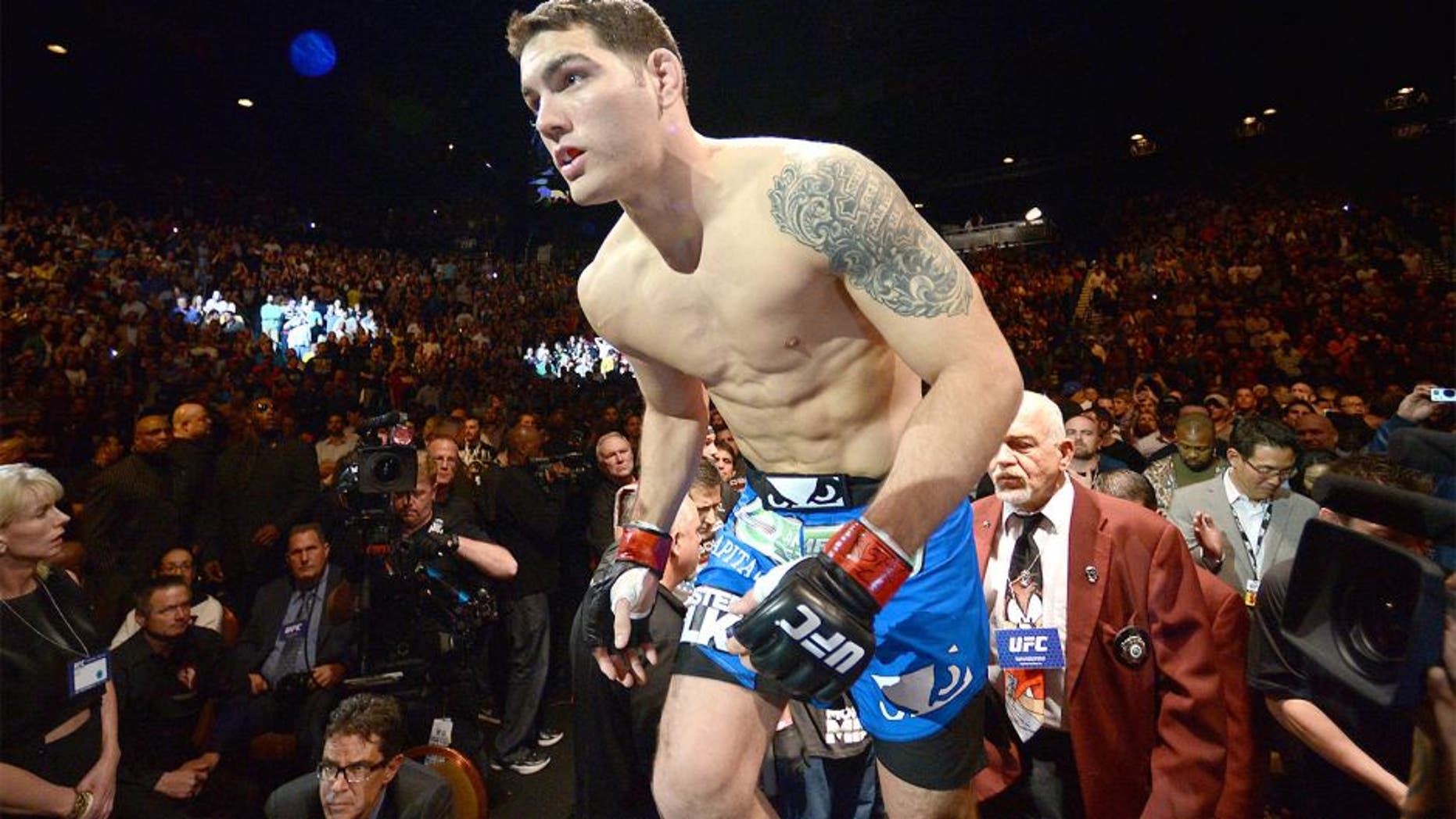 LAS VEGAS, NV - DECEMBER 28: Chris Weidman enters the Octagon to face Anderson Silva in their UFC middleweight championship bout during the UFC 168 event at the MGM Grand Garden Arena on December 28, 2013 in Las Vegas, Nevada. (Photo by Donald Miralle/Zuffa LLC/Zuffa LLC via Getty Images)