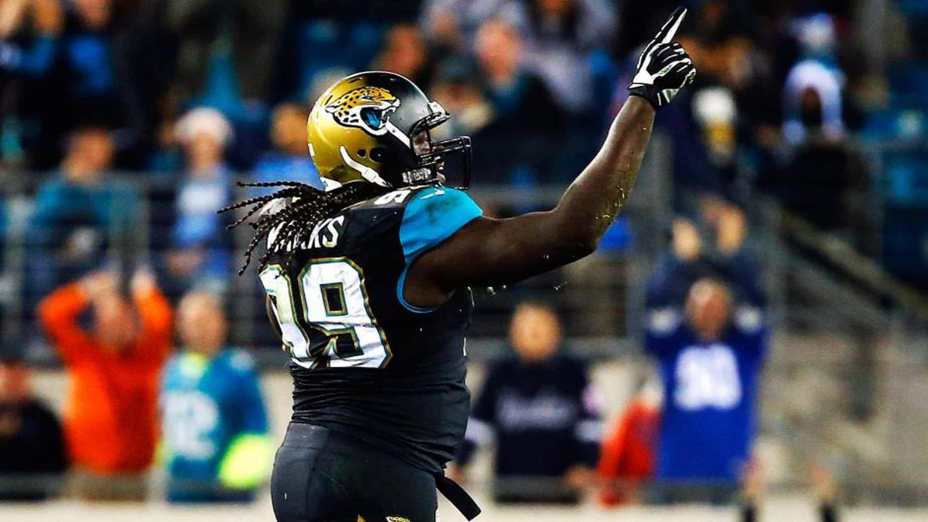 JACKSONVILLE, FL - DECEMBER 18: Sen'Derrick Marks #99 of the Jacksonville Jaguars celebrates a sack in the fourth quarter against the Tennessee Titans at EverBank Field on December 18, 2014 in Jacksonville, Florida. (Photo by Sam Greenwood/Getty Images)