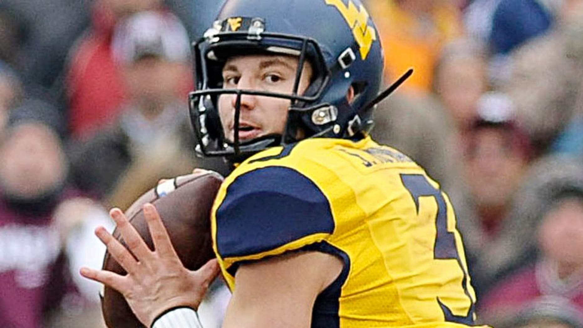 Dec 29, 2014; Memphis, TN, USA; West Virginia Mountaineers quarterback Skyler Howard (3) during the game against the Texas A&M Aggies in the 2014 Liberty Bowl at Liberty Bowl Memorial Stadium. Mandatory Credit: Justin Ford-USA TODAY Sports