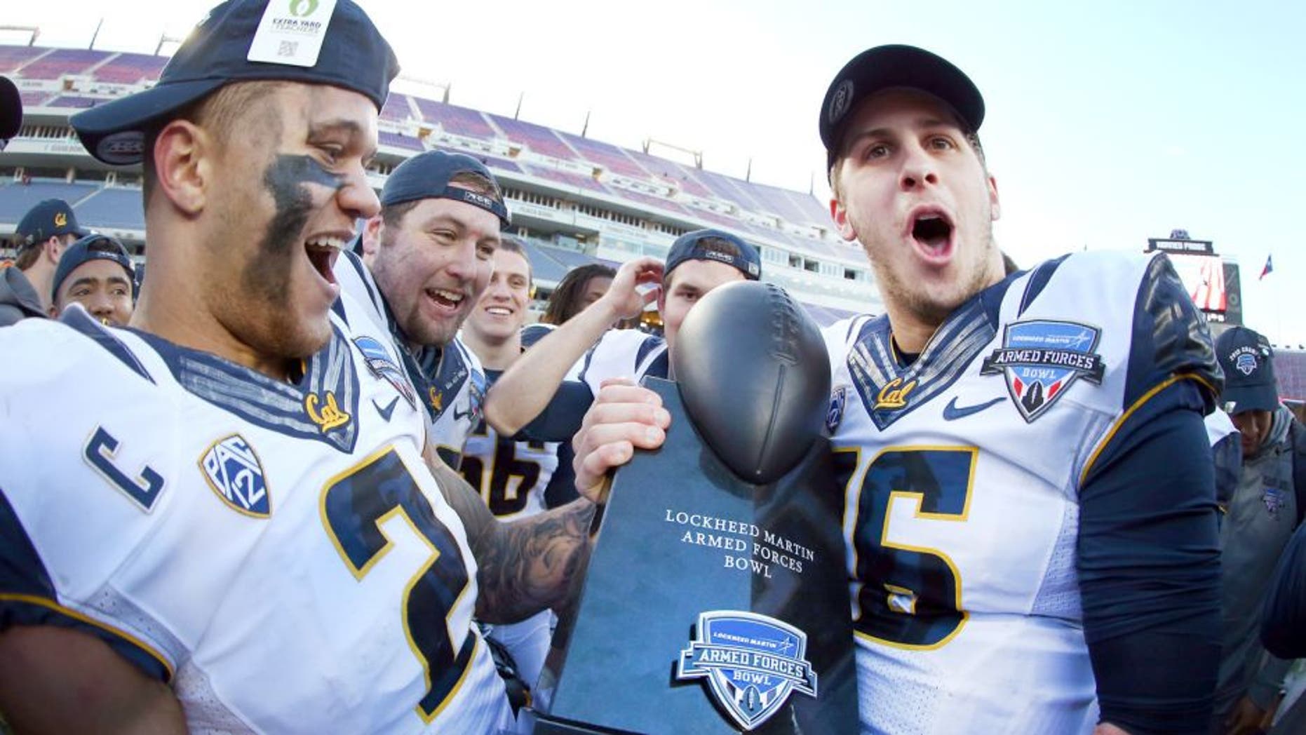 FORT WORTH, TX - DECEMBER 29: Daniel Lasco #2 of the California Golden Bears and Jared Goff #16 of the California Golden Bears celebrate with the championship trophy after beating the Air Force Falcons 55-36 in the Lockheed Martin Armed Forces Bowl at Amon G. Carter Stadium on December 29, 2015 in Fort Worth, Texas. (Photo by Tom Pennington/Getty Images)